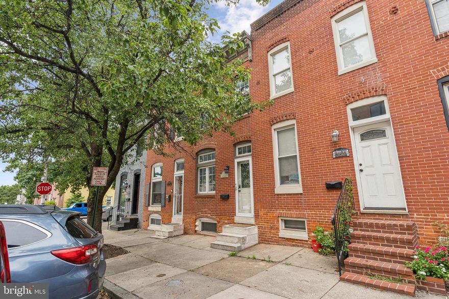 Welcome home to this move-in ready rowhome on a quiet block in the heart of Canton! This beautiful home shows off its original character with marble steps, exposed brick, a decorative historical fireplace and skylight. The freshly painted main floor features gleaming hardwood floors, an exposed brick wall, dining area and tons of natural light. The gourmet kitchen offers granite countertops, stainless steel appliances (brand new fridge 2025 and commercial grade range), ample solid wood cabinetry, gas cooking, tiled backsplash and a butcher block kitchen island. Off the kitchen you can entertain on your back patio enclosed with a privacy fence. Upstairs, you'll find a spacious primary bedroom with two bright windows and tons of closet space and a second bedroom. And a newly renovated full bath (2025). Another updated full bathroom is located on the lower level as well as ample storage space and a laundry area. The angled in street parking allows for more parking spots available. Recent updates include: Brand new full HVAC system (2024), new oven (2025), new fridge (2025), completely redone bathroom upstairs (2025), fresh paint on the main level (2025) and many more. Enjoy close proximity to retail shopping, local dining, Patterson Park, and major highways. Schedule your private tour today!