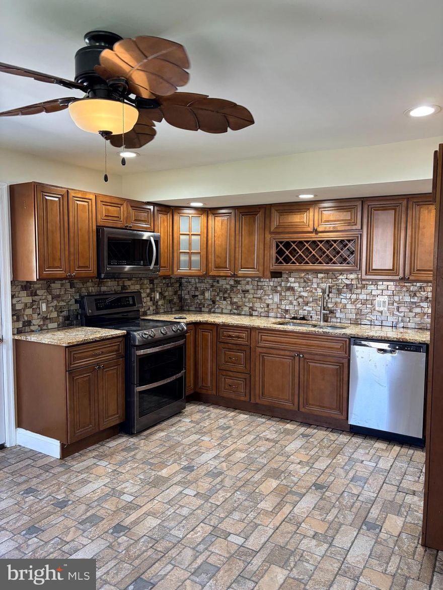 Welcome to this spacious and beautifully updated single-family home located just off Baltimore Pike in the desirable East Lansdowne area. Perfectly positioned near major highways, shopping, and popular eateries, this property offers both convenience and comfort.

This impressive home features 6 generously sized bedrooms and 3 full bathrooms, providing ample space for large households or multi-generational living. The main level includes two bedrooms and a full bathroom, along with the convenience of main-level laundry.

The updated kitchen is a standout, showcasing stainless steel appliances, stone flooring, and recessed lighting—perfect for both everyday living and entertaining. Hardwood floors flow throughout the home, adding warmth and character.

Additional highlights include a fully finished basement offering extra living or recreational space, a spacious deck for outdoor enjoyment, and a large lot situated on a quiet, tree-lined street.

Parking will never be an issue with a 2-car garage and driveway space accommodating up to 8 vehicles.

Please note: This sale must include the adjacent parcel located at 0 Hirst Avenue, offering additional potential and value.

Don’t miss the opportunity to own this versatile and well-located property. Schedule your showing today!