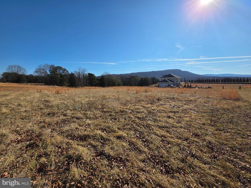 Build your dream home on this scenic flat 1-acre lot in a sought-after location just minutes from town. All paved roads lead to this property featuring beautiful mountain views! Minutes to the Shenandoah River and Skyline Drive. The lot is approved for a 3-bedroom septic system, and a builder is available, making this an exceptional opportunity to create your ideal retreat. Don't miss this opportunity! Call today to schedule your tour.