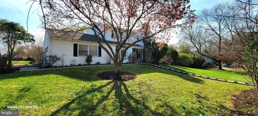 Meticulously maintained 4 bedroom colonial situated on a picturesque corner lot features mature landscaping, hardscaping, sidewalks and partially fenced in rear yard.  The maintenance fee exterior features siding with stunning stone accents and a two car side entry garage.  The home features a spacious country kitchen with oak cabinetry, center island with seating, stainless steel appliances, tile flooring and recessed lighting.  The formal dining room features access to a very large rear partially covered concrete patio perfect for entertaining or just relaxing and enjoying nature.  The living room features a stone wood burning fireplace with plenty of natural light.  The family room features a large bay window overlooking the mature landscaping.  Original hardwood flooring as well as some tile flooring, a powder room and laundry complete the main level.  The second level features a large primary bedroom with a walk in closet, additional closet and a primary bath, three additional bedrooms and a hall bath.   A spacious basement with walkout exit.  This property is an entertainer's dream, featuring excellent flow from room to room.  The layout provides a perfect space for large gatherings, family events, and special occasions. A must see meticulously maintained home.