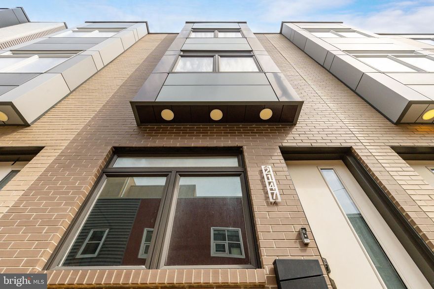 Welcome to 2147 Cross St.! This 2,000 sqft. "five-years-young" home features 3 bedrooms, 2.5 bathrooms, a fully finished basement, and a roof deck with panoramic skyline views. Its new owner will benefit from newer plumbing, electric, HVAC, and everything else, along with 5 years remaining on the tax abatement. Open the front door to the bright living area, with soaring 10-foot ceilings and oak hardwood floors. South-facing windows allow natural light to pour in all day. A convenient half bath is on your left as you continue to the modern kitchen, with upgraded and like-new appliances, cabinets, and countertops. A tall glass door leads to a sunny patio area, which is perfect for grilling, entertaining, or relaxing. Down the stairs from the kitchen, the daylight basement is ideal as a gym, den, storage, or guest bedroom. As you go upstairs to the second floor of the home, find two large bedrooms with oversized windows. Stacked laundry and full bathroom are placed in between. Going up another level, you'll enjoy the primary suite, which spans the entire floor and boasts ample closet space. The stunning en-suite bathroom features a large glass shower, double sinks, free-standing tub, and skyline views. A wet bar sits outside the suite, perfect for preparing drinks to bring up to the roof deck. The gorgeous deck offers stunning and unobstructed skyline views. This listing is close to multiple SEPTA bus routes, and the Tasker-Morris Station on the BSL. Take a quick walk north and you'll have the popular El Mezcal, 2 Eagles Cafe, and Dock St. Brewery (among more) to choose from. Walk east to all the great restaurants and cafes west of Broad St. (Stina, American Sardine Bar, Hardina). Or, carry on walking a few more minutes and be in East Passyunk with all it has to offer. 2147 Cross St. is ready for its next owner - we can’t wait to have you come by.