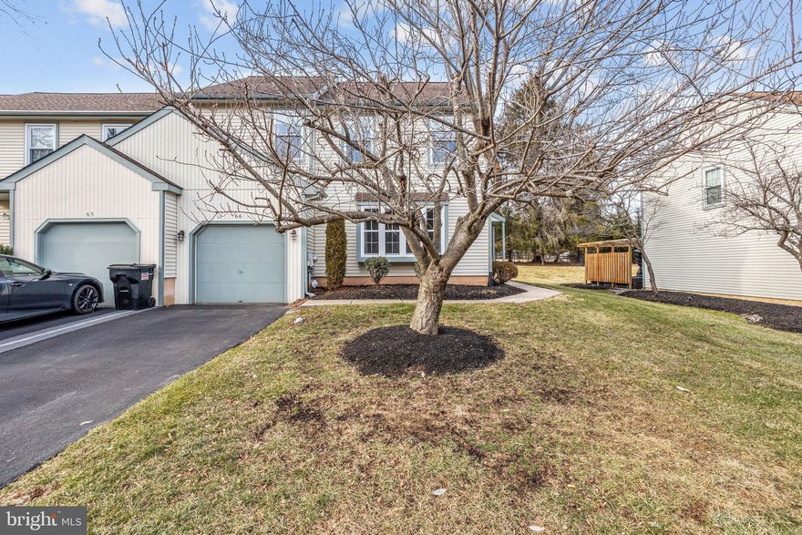 66 Laurel Circle is located in the desirable Whispering Woods section of the Newtown Grant community and is part of the award-winning Council Rock School District. This Newtown model end-unit town-home offers both comfort and convenience. A side entrance welcomes you into a sun-drenched living room and formal dining room. The home features an eat-in kitchen with granite countertops and wood cabinetry. 

Off the kitchen is a spacious cathedral-ceiling great room with a fireplace flanked by windows, creating a warm and inviting space. Sliding glass doors lead to a patio and a generous rear yard, perfect for outdoor enjoyment.  Completing the main level are a remodeled powder room, hall closet, and a laundry room with direct access to the garage.

The second floor features a primary bedroom suite with a full bath, upgraded shower, large soaking tub, and walk-in closet. Two additional well-sized bedrooms and a full hall bath complete the upper level.

Notable updates include new heating and air conditioning, newer windows, siding, and carpeting. The home has been nicely maintained and is truly move-in ready.

Conveniently located with easy access to road, rail, air, and the Princeton Route 1 corridor, Newtown Grant offers an active lifestyle with a recreation coordinator, outdoor pools, pickle ball, basketball, baseball, volleyball courts, a tot lot, and an on-site private daycare facility. Immediate occupancy available.