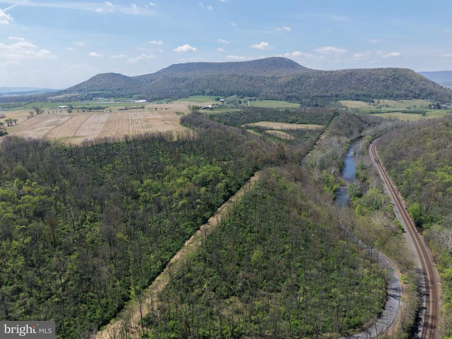 ONCE IN A LIFETIME OPPORTUNITY IN HUNTINGDON COUNTY, PA! This exceptional 358± acre property offers a remarkable blend of productive farmland, scenic woodland including an abundance of mature timber - especially walnut, and over 8,000 feet of frontage along the Little Juniata River—a renowned wild trout stream and one of Pennsylvania’s most sought-after stretches of trout water. The river showcases excellent diversity, from lively riffles to deep holes, creating ideal habitat for quality Brown and Rainbow trout and making it a premier destination for anglers. Approximately 102 acres are tillable with productive soils including Hagerstown Silt Loam, making this an ideal working farm, recreational retreat, or investment opportunity. Outdoor enthusiasts will appreciate outstanding hunting with abundant wildlife including deer, turkey, and more, along with exceptional fishing right on the property. The farm features a 2-story farmhouse offering 3 bedrooms and 2 bathrooms, along with a kitchen, dining room, living room, laundry area, basement, and attic. Additional improvements include a large bank barn and equipment shed, providing ample storage. Held within the same family for generations, this property presents a rare chance to own a legacy farm in a highly desirable location. Conveniently situated near Route 453, Route 22, and I-99, and just minutes from Huntingdon, Alexandria, and surrounding areas. Also approx. 17 miles to the Snyders Run boat launch at Raystown Lake! Don’t miss the opportunity to make this extraordinary property your own! This property will be offered at auction on Friday, June 12, 2026, at 1:00 PM. The list price in no way represents a minimum, starting, or acceptable bid.