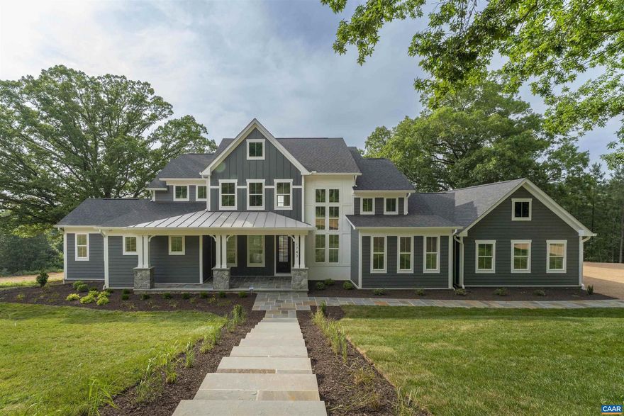 Incredible mountain views less than 10 minutes from downtown Charlottesville! This stunning 5-bedroom, 4.5-bath modern farmhouse sits on over 7 acres and blends timeless style with thoughtful design. A level front yard welcomes you to the charming covered porch, ideal for relaxing while taking in the neighborhood scene. Inside, an open, light-filled floorplan showcases quality craftsmanship at every turn. The chef?s kitchen boasts a 48? gas range, oversized island, and seamless flow to the 2-story great room, where a soaring fireplace with custom live-edge mantle steals the show. Step onto the covered deck to enjoy peaceful year round mountain views. The first-floor primary suite is a private retreat, featuring its own spa-like bath with soaking tub, dual vanities, and an expansive walk-in shower. Upstairs, three spacious bedrooms and two full baths provide room for family and guests. The walkout basement offers even more versatility with a generous rec room, guest suite, and full bath.,Painted Cabinets,Quartz Counter,Fireplace in Great Room,Fireplace in Master Bedroom