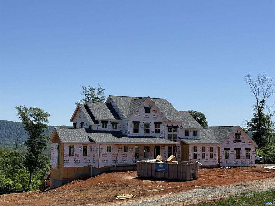 Incredible mountain views less than 10 minutes from downtown Charlottesville! This stunning 5-bedroom, 4.5-bath modern farmhouse sits on over 7 acres and blends timeless style with thoughtful design. A level front yard welcomes you to the charming covered porch, ideal for relaxing while taking in the neighborhood scene. Inside, an open, light-filled floorplan showcases quality craftsmanship at every turn. The chef?s kitchen boasts a 48? gas range, oversized island, and seamless flow to the 2-story great room, where a soaring fireplace with custom live-edge mantle steals the show. Step onto the covered deck to enjoy peaceful year round mountain views. The first-floor primary suite is a private retreat, featuring its own spa-like bath with soaking tub, dual vanities, and an expansive walk-in shower. Upstairs, three spacious bedrooms and two full baths provide room for family and guests. The walkout basement offers even more versatility with a generous rec room, guest suite, and full bath.,Painted Cabinets,Quartz Counter,Fireplace in Great Room,Fireplace in Master Bedroom