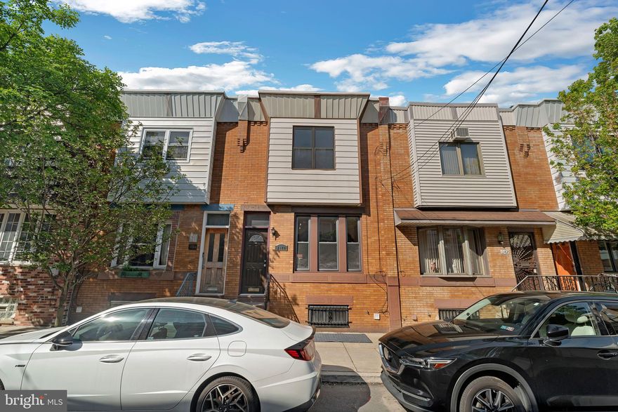 Three bedroom, one and a half bath townhouse less than one block from the Singing Fountain in Passyunk Square. Enter through a vestibule to find original, restored wood floors with mahogany inlay. Convenient half bathroom on the first floor.  Large kitchen with tile backsplash and stainless steel appliances, including a dishwasher. Plenty of windows provide abundant natural light. Spacious private back patio. The second level has three bedrooms, each with closet space. Brand new ductless mini-splits for air conditioning! Full basement, with washer and dryer and ample storage space. Located just steps from Passyunk Avenue, Columbus Square Park, ACME grocer, Pat's & Geno's, and many more notable shops and restaurants. Tenant is responsible for utilities.