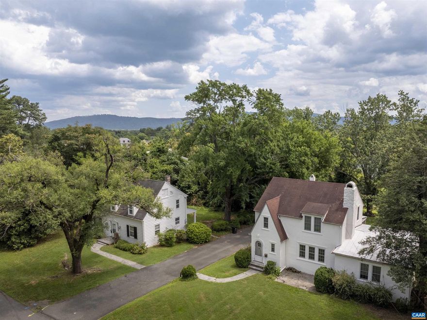 Zoned RX-3 with no density restrictions! Unique opportunity to purchase TWO houses on Stadium Road. Both parcels combined total .71 acres in a prime UVA-adjacent location, right across the street from Runk Dining Hall. Each house is character-rich with many original details preserved, including hardwood floors, craftsman-trim, original glass doorknobs, plaster walls, built-ins (2203), gas fireplace with brick surround (2201), an incredible stone fireplace (2203), generously-sized spaces, and dedicated dining rooms. Large, level lot is a rare find in Charlottesville. 2201 is 3 bedrooms, 1.5 bathrooms. 2203 is 3 bedrooms, 2 full bathrooms with an attached, separately metered apartment that is 1 bedroom, 1 full bathroom (no kitchen). These houses are GEMS, with some updates they could be fantastic single-family homes or upscale rentals. OR, consider the future possibilities of increasing density in a prime UVA location.,Fireplace in Living Room