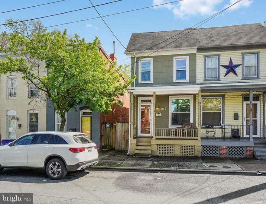 This lovely historic duplex in downtown Frederick  is full of charm and character! Close to all that downtown Frederick has to offer, this home is situated in a great commuter location. Walk to all the fantastic amenities in Frederick--Carroll Creek, Baker Park, the library, restaurants, shops & festivals. This home includes an updated kitchen, updated electric, plumbing and windows. The light-filled living room and dining room each feature gleaming hardwood floors, original wood trim, and a lovely mantle in the dining room. Walk out from the kitchen to the fenced backyard with patio and plenty of space for gardening. The main level also includes a half bath and convenient laundry center. The upper level features three bedrooms and hardwood floors. The rear bedroom features an en suite bath with claw foot tub--and a private covered balcony that overlooks the fenced backyard. Enjoy your morning coffee on the balcony or the front porch! The upper level includes two more bedrooms--each with large closets. All this, plus an attic and basement with concrete floor. Don't miss this opportunity! This home won't last long!***Check out our 3D home tour on Zillow: https://cutt.ly/Gt9sbzq***Contact listing agent for a virtual home tour!*** Here is the link to our walkthrough video:  https://www.youtube.com/playlist?list=PL0j7p96aFtsWHMZW0oYl9VpQrjfPtquZB