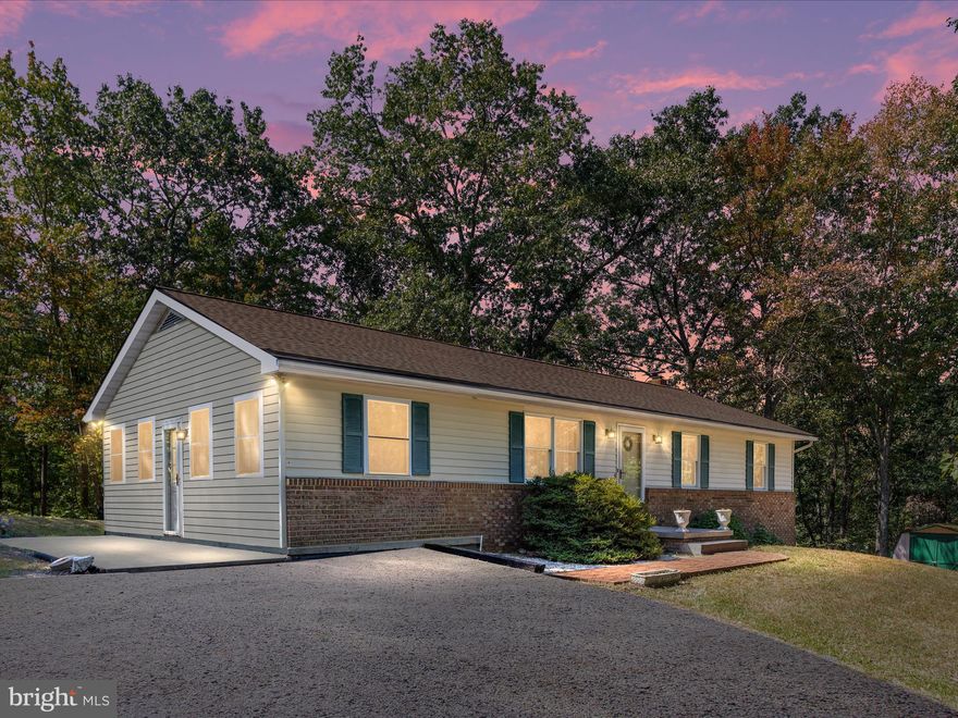 Welcome to 129 Little Creek Trail in Berkeley Springs. This 3 bedroom rancher sits on 2 acres with no HOA, offering peaceful surroundings and room to enjoy the outdoors.

Inside you’ll find a comfortable family room with updated flooring, a kitchen with dining space, and a sunroom that opens to a patio on the side of the house.

The lower level offers a recreation space, additional room that can be used as a den, office, or bedroom, storage space, plus a washer and dryer. A wood-burning stove warms the whole house!

NEW ROOF and freshly power washed exterior. The property also features a water treatment system and a storage shed.

Conveniently located near War Memorial Hospital, Blue Ridge Community & Technical College, and the lovely town of Berkeley Springs with its shopping, dining, and charm. Whether you’re looking for a full-time residence or a weekend retreat, this home offers the perfect blend of comfort, convenience, and space.