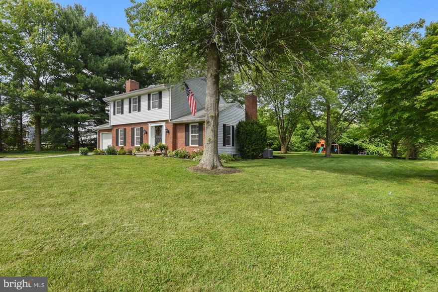 Turn key, appealing colonial in a picturesque country setting. Let time slow down as you sit on the front porch and take in the views of the rolling hills. This timeless colonial offers everything you need. An updated eat-in kitchen with stainless steel appliances and tons of cabinet space that opens to the family room with one of two wood burning fireplaces. The french doors take you to the covered back patio and level rear yard where your chickens can roam, surrounded by mature trees in a truly private setting. A bright and open living room with another wood burning fireplace that's been custom white washed, a dining room, or currently used as a playroom, with board and batten molding, a powder room, plus a recently renovated laundry/mud room with access to the attached garage round out the main level. The upper level boasts three spacious bedrooms including the primary suite with it's own full bath and a tastefully renovated full hall bath. Stunning hardwood flooring throughout the whole house and neutral decor make every room an inviting, comforting space. The lower level is ready for your imagination and finishing touches to make it exactly how you want. A bucolic setting in a great location, convenient to route 30 with great schools!