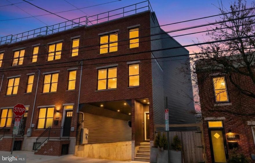 Tucked away in one of East Falls’ most charming settings, this newly constructed carriage home offers the perfect blend of modern design and warm, sophisticated finishes. Sun-filled, open-concept living spaces feature rich hardwood floors, soaring ceilings, and a dramatic multi-level staircase that serves as a striking architectural focal point.

The thoughtfully designed kitchen anchors the main level with crisp white cabinetry, quartz countertops, a statement tile backsplash, stainless steel appliances, and a generous island ideal for gathering and entertaining. Contemporary railings and globe pendant lighting enhance the home’s clean, modern aesthetic, while the open layout allows for seamless flow between living and dining spaces.

Upstairs offers three generously sized bedrooms with ample closet space, a hall bath, and a spacious primary suite with a walk-in closet and a beautifully appointed ensuite featuring a walk-in shower and dual vanities.

A standout feature of the home is the expansive roof deck, offering stunning views of the Center City skyline, perfect for relaxing or entertaining. Ideally located near neighborhood parks and trails, with convenient access to Kelly Drive, Center City, and major transit routes.

Additional highlights include a whole-house Aprilaire humidification system (installed 2025), two off-street parking spaces, abundant storage including space beneath the main staircase, a dedicated laundry area at the rear entrance, and approximately six years remaining on the tax abatement.

A rare opportunity to own newer construction in one of Philadelphia’s most desirable neighborhoods.