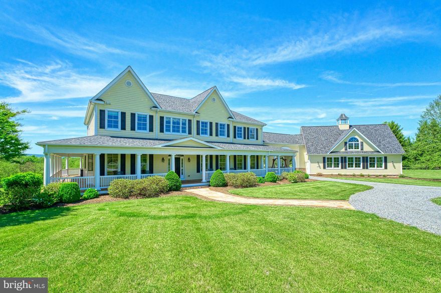 Offer deadline May 16th 12:00PM .This exceptional custom-built estate, on more than 11 scenic acres just outside the charming village of Waterford, is offered for the first time for sale. Perched atop a gentle hill, the home commands panoramic views of rolling fields and endless open skies in every direction.

From the moment you arrive, the thoughtful design and timeless craftsmanship are unmistakable. A gracious wraparound front porch invites you to linger, while a stately porte cochere leads to a spacious three-car garage—with additional space upstairs waiting for your custom finish.

Inside, a grand foyer welcomes you with immediate sightlines to the serene outdoors. A soaring staircase, the home’s architectural centerpiece, sets the tone for the refined aesthetic found throughout. Every room is carefully positioned to capture the surrounding beauty, bathing the interiors in natural light and offering a continuous connection to the landscape.

At the heart of the home is a gourmet kitchen, fully equipped for the passionate cook or baker. High-end appliances, custom cabinetry, and sophisticated finishes create a space that is both functional and striking.

Adjacent to the kitchen, the show-stopping solarium is the home’s crown jewel—a light-filled sanctuary with floor-to-ceiling windows that frame the gently sloping backyard like a living work of art.

Upstairs, the primary suite is a luxurious retreat featuring a spa-inspired bath, a well-appointed dressing room, and a private balcony with peaceful views of the mountains and fields stretching down to Catoctin Creek. Three additional generously sized bedrooms each offer en-suite baths and their own heating and cooling zones, providing the ultimate in personal comfort. 

Meticulously maintained and lovingly designed, this home is a true original. A geothermal system is just one of many thoughtful features that reflect the care, quality, and deep connection to its extraordinary natural setting.