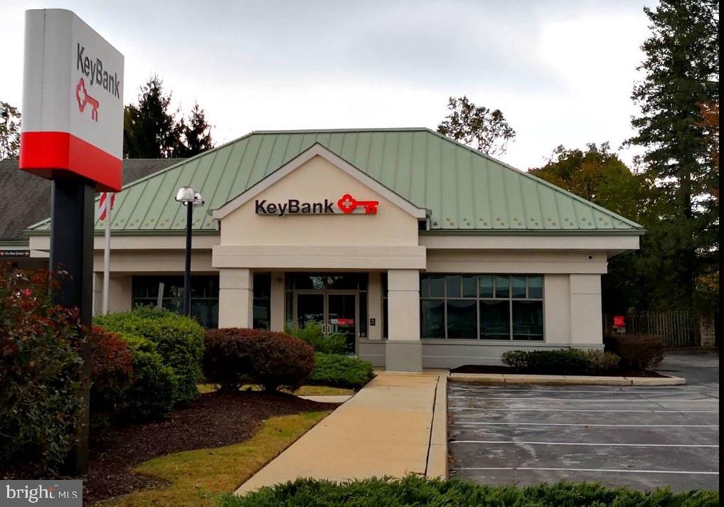 Commercial space for sale, 2,916 square foot above grade building. Modified/renovated over the last 20 years. Currently operating as a Keybank (operated as a bank branch for at least 20 years) with 3 drive-thru stations. Room layout: Open lobby, 6 teller stations, 4 private offices, storage room, employee break room, and 2 restrooms. It's a slab-on-grade foundation (no basement). Interior finishes consist of tile floors in the lobby, VCT or ceramic tile bathroom floors, and either laminate or wall-to-wall carpeting throughout the remaining areas. Other interior finishes include vinyl covered/wallpaper drywall partitions, vinyl baseboard trim, and acoustic tile drop ceilings with both fluorescent and recessed lighting. Lot size is 27,700 square feet. Also available for rent $14,000/month, see rental listing PACT2110014 for details.