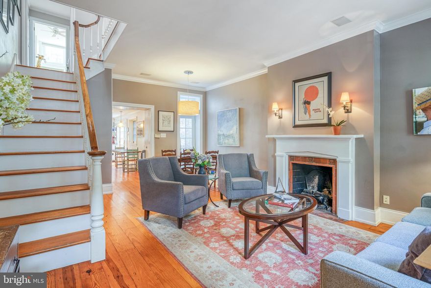 French country style town home in the heart of Fitler/ Rittenhous Square  This home is awash in sunlight and consists of three bedrooms and  3 1/2 baths with a deck, finished lower level and a potential parking spot in the rear. Enter into the living room with original  wide plank hardwood floors, gas fireplace, dining area with lovely chandelier and French door leading out to a lush green patio garden with brick pavers and magnificent sliding barn doors to the street and storage units.Coat closet in the hallway and large eat-in kitchen with recessed lighting, pendant lamp over dining area, stainless steel appliances and an abundance of counter space, natural light and a pantry closets. There are double French doors leading out to the patio gardenSecond floor features a beautiful back bedroom suite with two exposures, high ceilings,  five windows, and a French door leading out to a beautiful little deck. Bathroom with a walk-in Carrera tile shower and a window in the bathroom.  Hallway bathroom with Carrera marble floor, subway tile backsplash and window in bathroom with the linen closet and ceiling light. Front bedroom with two windows overlooking Rittenhouse Street and  large closet.Next level has a sky light  over the stairwell and a window in the hallway leading up to the master bedroom suite with a ceiling fan and windows over looking Rittenhouse Street.Two nice size closets and loft storage. Marble bathroom with walk in shower and window.  Fully finished lower level with terra-cotta tile floors, a powder room, a closet with washer and dryer and mechanicals and  living space which is used for watching TV with wainscoting. Hidden behind a bookcase there is a secret compartment that leads to more storage. The minute you step into this lovely space you will fall in love.