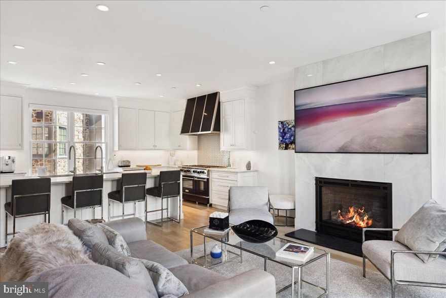 Welcome to the heart of picturesque New Hope, PA, where a newly finished, ready-to-move-in luxury condo awaits your exploration. Tucked into the town's vibrant core, this stylish home has been meticulously outfitted with designer finishes and offers breathtaking views of the Delaware River and its charming Canal. The property is a magnificent blend of modern amenities and extravagant features, including an elevator and a rooftop terrace. Significant investments have been committed to exceptional upgrades including a gourmet chef's kitchen, showcasing an immaculate eight-burner Bluestar range with a Modern-Aire hood, chic white-leathered granite countertops, delicately beveled Plato cabinets, and a functional workstation kitchen sink specially designed by The Galley. The adjacent dining area shines with a stunning statement light fixture, built-in ice maker, an additional refrigeration drawer, a Subzero wine cooler and additional countertop and cabinet storage.  The home's four levels are adorned with light white oak engineered flooring and tasteful color choices, encompassing four bedrooms and a dazzling primary suite that occupies the top floor. This suite opens onto a secluded outdoor terrace, offering a chance to take in the striking views of the historic town. From the famous Bucks County Playhouse to the charming local architecture, you can soak up every delightful aspect of New Hope from this unique vantage point. Other remarkable features of this high-end home include a sleek horizontal cable railing, an elegant marble fireplace, carefully chosen plumbing and lighting fixtures, and a generously sized two-car garage. Dive into the lively river-town lifestyle, where trendy boutiques, award winning eateries, and art galleries are just steps away from your front door. Make the most of the nearby canal path for relaxing bike rides or tranquil walks, and savor the perfect mix of a buzzing nightlife and the serene sanctuary offered by this luxurious haven.