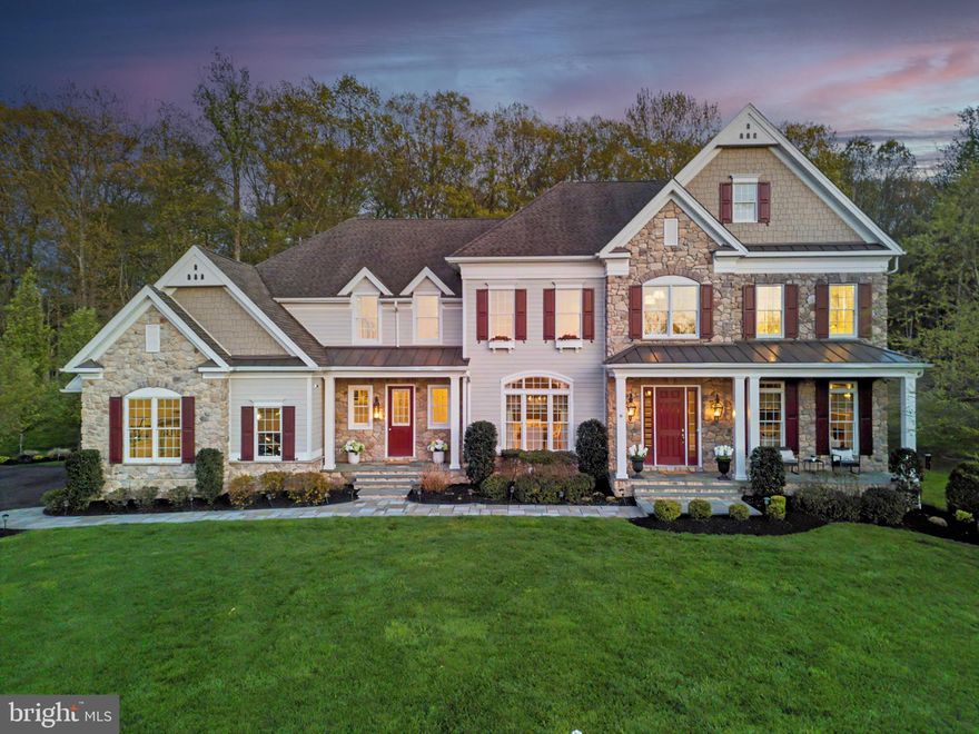 Step into a world of refined luxury at this stunning masterfully crafted home, nestled in the prestigious Upper Makefield community of Dutchess Farm Estates. Commanding the highest elevated lot in the neighborhood on a quiet cul-de-sac, this exceptional property boasts breathtaking, long-range views of Jericho Mountain and is surrounded by lush, wooded landscapes, and sounds of nature. Featuring 1.31 acres of immaculate grounds, complete with meticulously maintained landscaping with a panaramic forest view backdrop that changes colors throughout the seasons, enchanting bluestone walkways, strategic lighting, and an advanced irrigation system, this estate redefines outdoor beauty.

This home presents a rare opportunity to acquire a residence in this exclusive 67-lot estate community. The stately stone façade makes an immediate impression, leading you into an elegant spacious foyer with forest views that sets the stage for the unfolding sophistication.

Upon entry, you’ll be greeted by soaring 10-foot ceilings and an elegant oak staircase adorned with white spindles, complemented by rich maple hardwood floors that flow seamlessly throughout. To your right, the radiant formal living room, featuring a gas fireplace with a custom marble mantel, invites you to unwind in style. On the left, the sophisticated formal dining room awaits, accompanied by a Butler’s Pantry for effortless entertaining.

The gourmet kitchen serves as the heart of this luxurious home, showcasing exquisite 42-inch white cabinets, stunning granite countertops, and a massive center island that comfortably seats four. Outfitted with top-of-the-line appliances, including a 42-inch Sub Zero Refrigerator and a professional Jenn Air range, this kitchen is a culinary enthusiast’s dream. Adjoining the kitchen is a bright breakfast room, perfect for morning gatherings, and an additional planning center for convenience.

The grand family room impresses with 12-foot ceilings, a welcoming double-sided fireplace, and walls of windows with transoms that immerse the space in natural light. A formal office/library/flex room, featuring vaulted ceilings, its own fireplace, and picture windows with a forest back drop offers an ideal space for productivity or quiet reflection.

The main floor also hosts a beautifully appointed 5th bedroom suite, complete with an exquisite bath—perfect for guests or family members requiring privacy. Enhancing functionality, a mudroom entry with cubbies and additional storage, along with a convenient powder room, rounds out the first level.

Ascend to the luxurious upper level, where the opulent Primary Suite awaits. This serene retreat includes a spacious sitting area, a main bedroom adorned with a coffered ceiling, and a spa-like Master Bath featuring an oversized custom shower with multiple spray options, lavish Carrara marble finishes, and an expansive walk-in closet complete with a center island and pendant lighting. Each of the three additional bedrooms is bright and airy, all with en-suite baths, while a bonus entertainment/upper family room area offers versatile living space. The oversized laundry room and convenient rear staircase complete this remarkable level.

This exquisite home is outfitted with premium features and upgrades, including top-of-the-line Anderson 400 series windows, a Control 4 sound, video, and security system, an 8-person Caldera Spas hot tub, a three-car garage, an expanded driveway, and a sophisticated four-zone heating and cooling system.

The expansive basement, with increased ceiling height, presents a blank canvas for your personal design touches, ready to accommodate your unique vision. Move-in ready and in pristine condition, this home is strategically located just minutes from the vibrant town centers of Newtown and New Hope, within the highly acclaimed Council Rock School District.

Don’t miss the chance to own this stunning estate—where elegance meets opportunity in a truly distinguished setting.