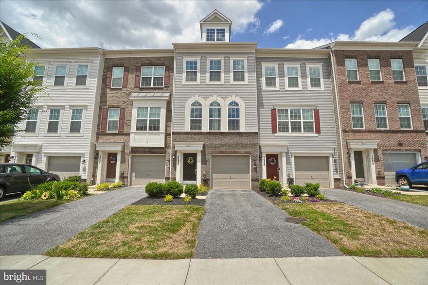 4th of July Firecracker in Jefferson Place!   Don’t miss this beautifully decorated upgraded townhome with a one car garage, gleaming hardwood flooring in the foyer leads down the hall to the office/family room or possible 3rd Bedroom with a ½ bath, walk out the sliding glass door to the concrete patio with a large common area of grass.  The main level welcomes you to an open living concept with tons of natural light, hardwood floors, recessed & pendant lighting, and a sliding glass door leading out to the trex deck with mountain views.  The gourmet kitchen features granite countertops, an abundance of white cabinetry, stainless steel appliances (microwave, refrigerator w/ice maker, dishwasher, and gas stove), an oversized large island is perfect for entertaining. Off the kitchen is a spacious living room with gorgeous Palladian windows, and a dining/eat in area. The third-floor features 9ft ceilings, the primary suite with an ensuite bathroom (double sinks, ceramic flooring and oversized ceramic shower), a laundry room with newer washer/dryer that conveys.  The 2nd bedroom offers an ensuite with a tub/shower with ceramic flooring/tub/shower surround.  Community amenities include pool, basketball, tennis & volleyball courts, gym, clubroom and dog park! Great commuter location; convenient to routes 70, 40, 270. Close by shopping & restaurants.  Come Take A Look!