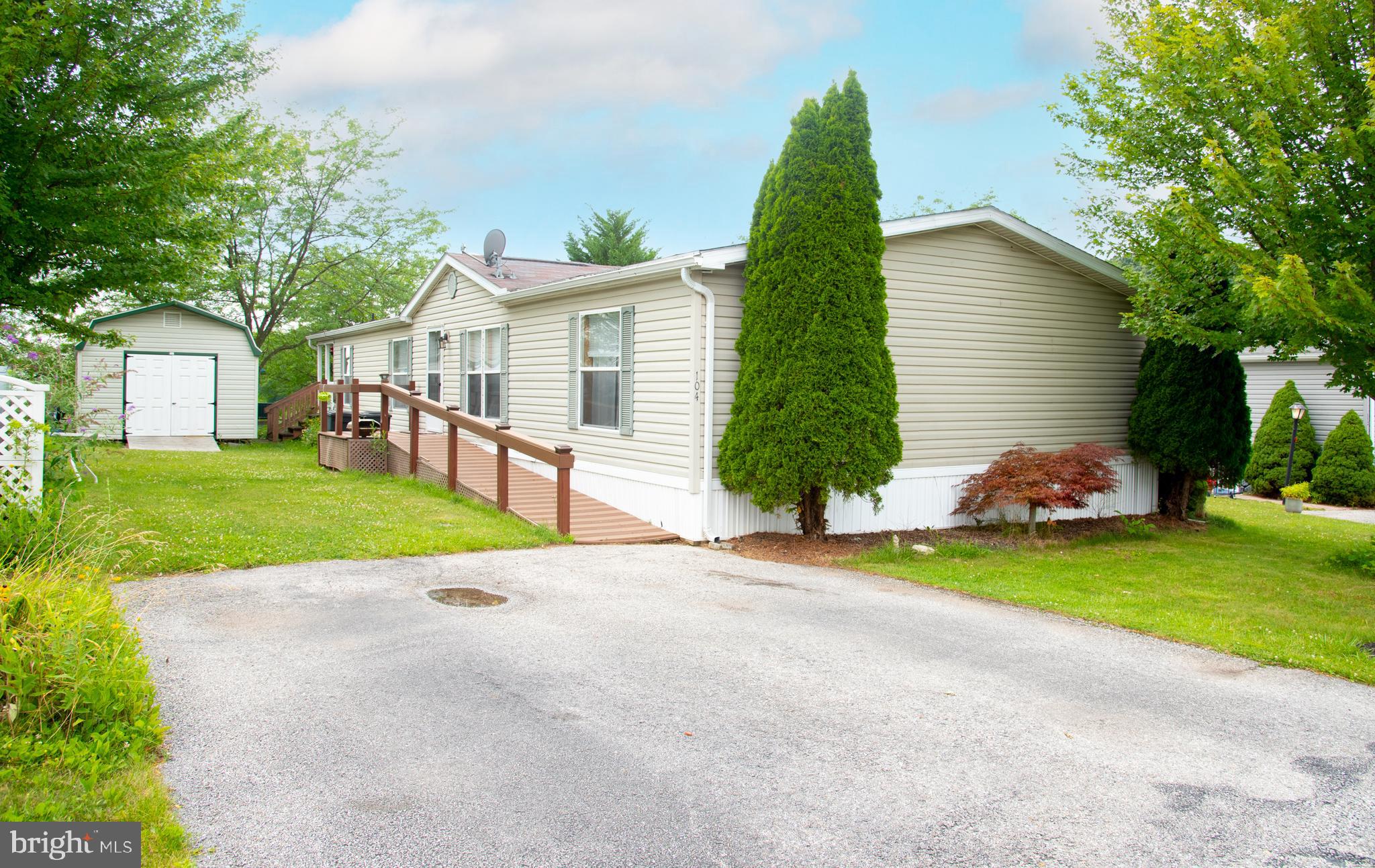 Welcome to Eagle View! This affordable home is situated in a beautiful manufactured home park and includes 3 bedrooms, 2 bathrooms, and a gorgeous covered porch with views of the mountains and surrounding area. From the spacious driveway a new deck/ramp awaits on the right cascading to the front door, and to the left a huge storage shed. The rooms are large and the primary bedroom includes a walk-in closet, bath with a garden tub, sky light, and a separate shower. Yard boasts a huge 12'x20' shed! Come see today!