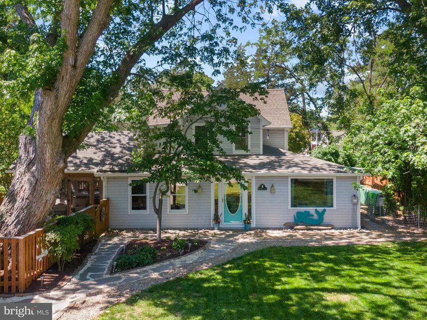 *Seller to include a 1 year American Home Shield Warranty "Complete" package which covers everything inside your home plus roof coverage! And the owner has just put a new upper roof on the main house August 2025!

Coastal meets Victorian in this exquisitely renovated home in the quaint waterfront village of Newcomb! The open floor plan exudes a peaceful vibe in every room--airy, light color palette, incredible indoor-outdoor living spaces. This home is all about enjoying life on the Eastern Shore! Cozy up by the gas indoor fireplace in the cooler months. Or enjoy the spacious screened porch for relaxing, eating crabs, reading a book, working remotely or visiting with family and friends.  Kick back in the hot tub after a long, stressful day.  And the gourmet kitchen with its white quartz countertops, island with bar seating, gas stove, cupboards to the ceiling, open shelving, and stainless appliances is just dreamy.  This property has previously sold as a 4 bed main house plus another bedroom above the garage, however, the main house is a 3 bed + a den (with the potential of adding a closet to make it  a  true 4th bedroom in the main house). The detached garage includes the bonus of a one bedroom, one bath studio apartment located above to house the overflow of guests (See private agent remarks for more details on apartment—which also boasts quartz counters). There is a fire pit,  outdoor shower for bathing those canine companions (or people in need of a bath after a day of fishing) and even a slight water view from the front yard! Launch your boat in Oak Creek at the end of the street (or contact the county RE slip avails). A good sized boat can also fit in the driveway. The property’s fenced yard provides privacy and a secure place for pets as well as plenty of space for gardening. You are in  St Michaels or Easton within minutes in either direction! 
And a bonus if you want an investment property or second home: the main home and apartment above the garage can each operate as a rental with approval from the neighbors on the street; other properties on the street have done so.
Flood insurance NOT required! 
Upgrades owner made include new upper roof main house (30 yr shingles), nine new windows, new skylight, new gutters, new sump pump, new well pump, remodeled powder room, partial French drain front yard, new duct work upstairs and downstairs, landscaping, new washer/dryer, new stove, Halo Remy blue light filter on both HVAC system, new stone in driveway, driveway graded, new water heater in studio apt over garage, partially encapsulated crawl space, new hot tub cover.
NOTE: List of all seller upgrades is available in the private agent remarks. Televisions in the primary sitting room, living room and studio apt above garage will convey, as will hot tub.