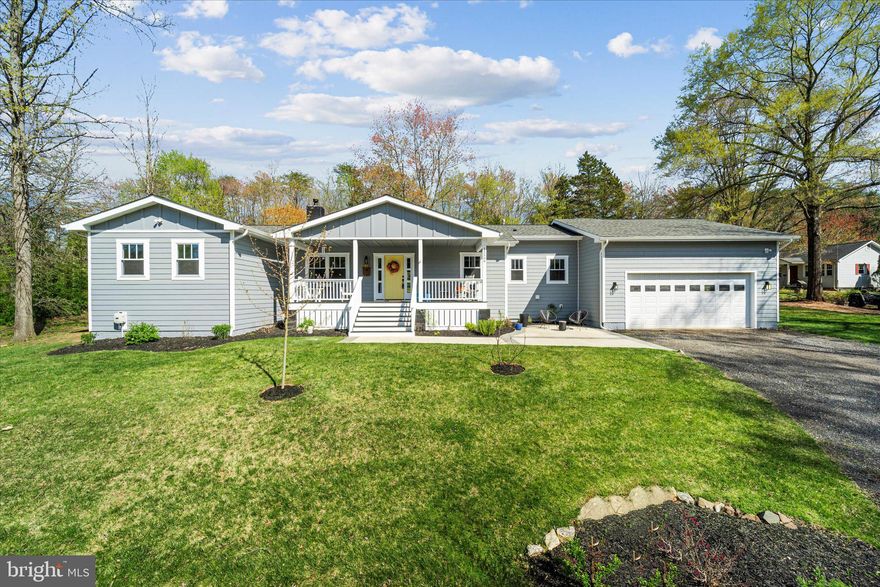 Welcome to one-level living at its finest, featuring this exceptional custom-built home, just three years young. Boasting a modern farmhouse aesthetic, the residence spans over 2,700 square feet of meticulously crafted space, housing 4 bedrooms and 2.5 bathrooms, all free from the constraints of an HOA. 
From the moment you arrive, the home’s captivating curb appeal draws you in, setting the stage for what lies beyond the charming large covered front porch. As you step inside, you will be greeted by the warmth of beautiful hardwood floors that span the main living area. An open floor plan, with tall ceilings adorned by striking wood beams, seamlessly integrates the kitchen, dining, and living spaces, creating an inviting ambiance throughout.
The heart of the home, a custom craftsman white kitchen, showcases hand-poured concrete countertops, stainless steel appliances, soft-close drawers, and convenient pull-out racks for pots, pans, and spices. The expansive walk-in pantry provides ample storage and is the perfect addition to the space. Every inch of the home has been well thought-out and beautifully designed, down to the charming batten board feature wall in the half bathroom. For the avid reader or remote worker, the built-in bookshelves in the office/library offer the perfect retreat. 
A magnificent concrete fireplace adds a touch of sophistication to the living space. It’s the perfect place to curl up with a blanket and cup of coffee on a cold day. Throughout the home, tall baseboards, and craftsman-style framing around all the doors and windows, enhance the overall elegance.
The primary bedroom offers a spacious sanctuary with a beautiful ensuite boasting double sinks, abundant cabinetry, and an oversized walk-in shower with a convenient niche for toiletries. Generously sized secondary bedrooms share a guest bathroom featuring double sinks and a shower/tub combo, all adorned with modern fixtures.
Step outside to enjoy the sprawling concrete patio in the backyard, perfect for outdoor gatherings and entertaining. The oversized garage offers additional functionality with a 466-square-foot finished space behind it, complete with central heating and AC, ideal for a workshop or hobby room.
Don't miss the opportunity to make this remarkable home your own; it’s truly one of a kind.