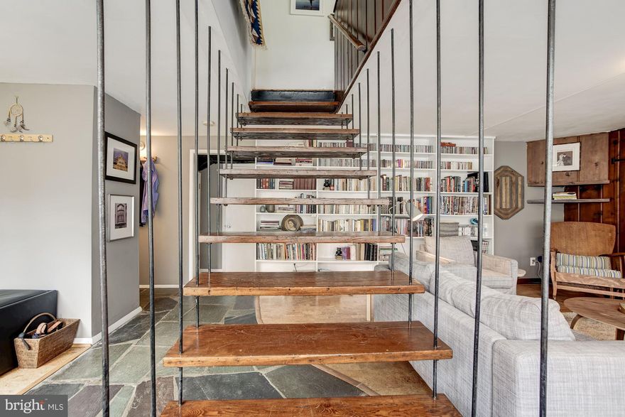 Check out this mid century modern with a kitchen renovation and family room addition that will check every box on your must have list.  Situated on a fully fenced cul de sac lot you enter on the main level in front of a floating staircase, walls of windows let in loads of ambient light.   There is a rarely available one car garage, three full bedrooms upstairs, two full renovated baths.