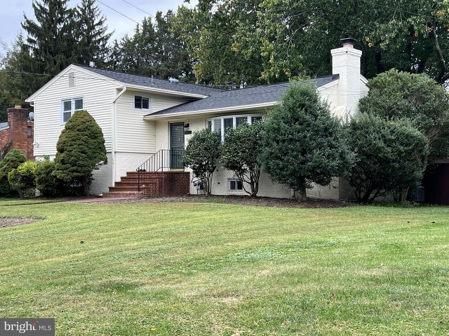 Spacious split level with wonderful flow throughout the house.  In great condition! Beautiful hardwood floors; new carpet.  Freshly painted.  Three bedrooms and three baths on four levels.  Laundry room with washer, dryer, and  utility sink on lower level.  Fully-fenced large yard and shed. Large, open kitchen and dining room each access the deck with it's screened-in area and the patio.  Four parking spaces in driveway and plenty of on-street parking.  Great home for living and entertaining.  Close to Tysons, McLean, and Falls Church.