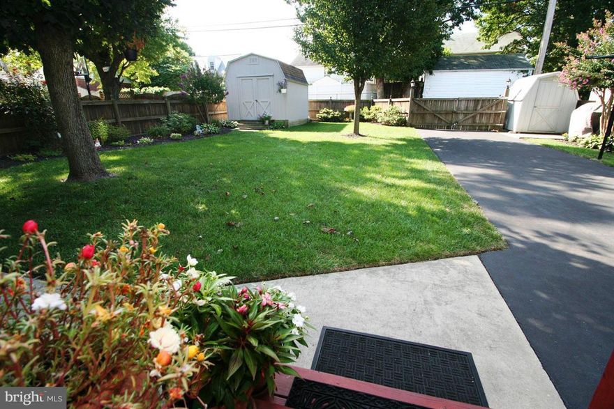 New Price! This beautiful home has been lovingly cared for & maintained for 38 years! Approx 2500 total Sq Ft. & lots of updates!  Features 3 BR's & 2 BA's. Upgraded kitchen, separate main level laundry room w/ full bath, hardwood under carpet, off street parking, Lrg 10x20 screened porch overlooking meticulously landscaped fenced in yard. Finished family room in lower level w/ lots of storage!