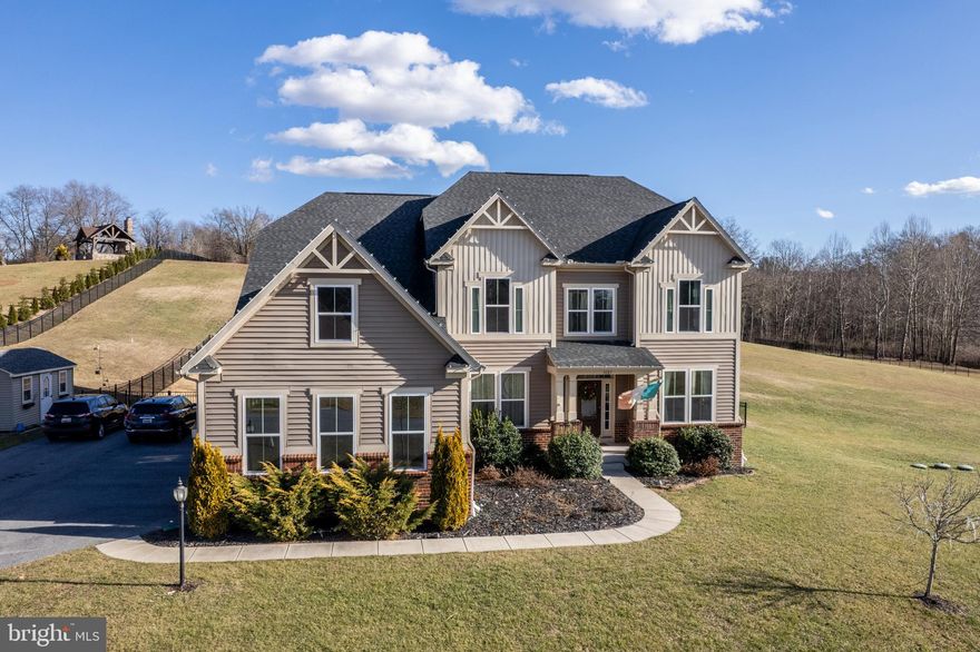 Welcome to 3127 Roberts Landing, a stunning 6-bedroom, 5 full-bath colonial-style home in the desirable Hewitt’s Landing community. Built in 2017, with over 6000 square feet of living space, this home features a high-efficiency natural gas HVAC system, sealed air ducts, Low-E windows, a tankless hot water heater, water-saving fixtures, as well as Energy Star appliances that all contribute to lower utility costs.  
Enjoy luxury living with GE appliances, granite countertops, and a beautifully designed kitchen featuring two-toned cabinets, a large island, double ovens, and a breakfast room flanked with windows and plantation shutters.  The main level offers 10-foot ceilings, hardwood floors, a two-story great room with a gas fireplace, front and back stairs, and a beautiful guest suite with a full bathroom including a walk-in bathtub. Upstairs, you’ll find a luxurious primary suite with a sitting area and coffee bar, an oversized closet, a custom ceramic tile corner shower, and separate double vanities.  There are 3 additional bedrooms upstairs with access to a private bathroom or a Jack and Jill bathroom between two bedrooms.   

The lower level is finished with a family room, game area, workout space, bedroom, full bath, and large storage area. The walk-up double sliding doors lead to a saltwater pool, oversized Trex deck, concrete patio, and black aluminum pool fence.  With the largest lot in the community, just shy of 3 acres, there is an open/flat area on the side of the house, as well as one of the best sledding hills around at the back of the property.  Be sure to check out the aerial photos to see how this lot can accommodate your lifestyle!
Don’t miss this exceptional home in the prime Finksburg location!