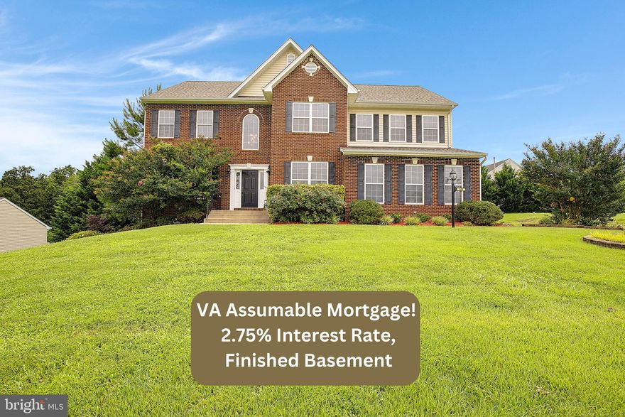 VA 2.75% INTEREST RATE ASSUMABLE MORTGAGE! Gorgeous brick front colonial with 5,200+/- SF including THREE FULL BATHS ON THE TOP LEVEL! No need to add extra time onto your commute from this centrally located Lorin's Pride neighborhood, just off Rte 4 in Huntingtown! You'll love the large owner's en suite with a huge sitting room that could also serve as a nursery or a personal office space.  Owner's bedroom has vaulted ceilings, spacious walk-in closet and  a bath  with a walk-in Tuscany tiled shower, soaking tub and double vanities.  Upstairs you'll also find a full sized laundry room  and three large bedrooms, INCLUDING A BEDROOM WITH A PRIVATE FULL BATH plus a 'Jack-and-Jill' full bath shared by the remaining two bedrooms. Kitchen has 42" custom maple cabinets, stainless steel appliances, including a 5-BURNER GAS COOKTOP & DOUBLE WALL OVENS! A generous island with granite countertops and pendant lights is perfect for entertaining. The focal point of the family room off the kitchen is a floor-to-ceiling stone fireplace (gas). Enjoy summertime grilling from the low maintenance composite deck, and store all your supplies in the underground storage beneath.  Main level has plenty of room to gather-- or to spread out-- with a separate dining room, living room, half bath and a home office. The lower level is where the party's at, with a theatre room complete with projector and screen, a large rec room, and an existing waterline hookup (for a wet bar to be installed).  Has a full bath and plenty of room in the unfinished storage area to easily add a 5th bedroom, if needed. Mechanicals have been updated; NEW DUAL ZONE  HEATING & AIR HVAC SYSTEMS IN 2023, new hot water heater in 2025, new roof in 2019. Septic was pumped in 2024 and has new dual pumps and a new septic alarm system installed. Has a 2-car Garage with a new wifi garage door opener, plus a double wide paved driveway for extra parking.  The .78 acre lot is beautifully landscaped and has a significant side yard that stretches to the corner of the street (to the grouped mailboxes).  Home has been freshly painted and carpeted throughout! Located near top rated school system including Huntingtown High School. Near  shopping, grocery stores, restaurants, hospital and movie theatre. Easy commute to Joint Base Andrews and Washington DC! *Is VA assumable.