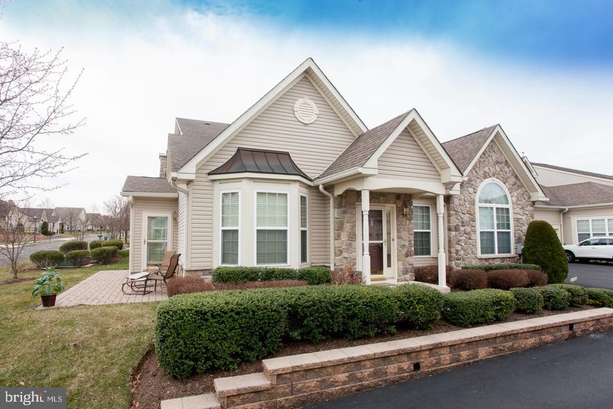 YOUR WAIT IS FINALLY OVER… This totally upgraded three bedroom, three bath Thornhill
Model in the prestigious 55+ community, The Villas at Five Ponds, is absolutely beautiful. You
will be impressed immediately when you see the stunning hardwood floors that greet you at the
foyer and continue through the living room, dining room, family room, and kitchen. This open
floor plan is just perfect whether you are relaxing with a good book in front of the fireplace on a
chilly night or entertaining friends and family intimately or for large gatherings. This outstanding
model continues to please the most discriminating Buyer with its large family room that adjoins
the upgraded kitchen. Beautiful 42 inch maple cabinets, stainless appliances, tile backsplash,
neutral granite counters, undermount lighting, a pull out spice rack cabinet, an expansive
breakfast bar and a pantry make this a kitchen that anyone would love. This home also features
a sunroom, a favorite spot to soak in the sun or enjoy the outdoors, be it inside or on the paver
patio just outside of the sunroom. Also located on the main level of the house is a guest
bedroom and guest bath as well as a generously sized primary bedroom. This
particular home features a stunning custom primary bathroom with two walls of cabinetry
including a makeup counter and fully tiled to the ceiling walk-in shower with seat. Completing
the first level of this house is a laundry room with built-in cabinetry and a storage closet. You
can access the oversized two car garage from the laundry room as well as enter a door that
takes you to the upstairs loft which can be used as a third bedroom or a multipurpose room.
Finishing off the loft is the 3rd full bathroom and a large finished storage room. Throughout
this great property you will find wonderful ceiling fixtures, custom window treatment , recessed
lighting, expansive windows and lots of storage space.  More great news...a new Heating and Air Conditioning System was installed in 2024.
The Villas at Five Ponds is an Active Community with a fabulous Renovated Clubhouse including a Multi-Purpose Room, a State of the Art Gym, Card and Game Rooms, a Library, Indoor and Outdoor Pools, a Walking Trail, Tennis, Basketball and Pickleball Courts, and Lots of Activities. Everyone loves living at Five
Ponds and so will you!