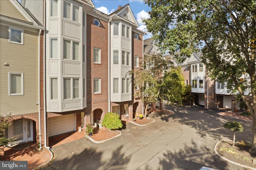 OPEN HOUSE CANCELLED. Seller has accepted an offer. Welcome to the enchanting Chesterfield Place, a hidden treasure that features an exclusive enclave of luxury townhomes rarely available for sale. This meticulously crafted 4.5-level townhome is nestled in the vibrant heart of downtown Leesburg, offering the ultimate convenience with an array of shopping, dining, and lively local events just a leisurely stroll away. Surrounding the community is a tapestry of lush green spaces, creating a tranquil oasis amid the bustle of urban life.

This charming residence boasts four elegantly appointed bedrooms, two full bathrooms, and one half bathroom, ensuring ample space for comfort and privacy. Rich, elegant wood floors infuse warmth and character throughout the living areas, inviting you to experience a true sense of home. The stunning kitchen is a chef's paradise, featuring a generous center island, exquisite granite countertops, abundant cabinetry, and skylights that bathe the room in natural light. Equipped with stainless steel appliances, this kitchen seamlessly flows into an updated rear deck complete with an awning, providing a picturesque setting for sipping morning coffee or losing yourself in a captivating book while overlooking serene green vistas.

The formal dining room sets the stage for memorable gatherings, while the living room boasts a charming bow window and a classic wood-burning fireplace, creating an inviting atmosphere perfect for cozy evenings. Ascend to the luxurious primary suite on the fourth level, where opulence meets comfort. This spacious retreat features a beautifully designed primary bathroom and a versatile loft area that can serve as a peaceful sitting nook, a productive home office, or a private gym, allowing you to personalize your living experience to suit your unique lifestyle.

The third floor hosts two generously sized bedrooms, accompanied by a full bathroom and a convenient,  laundry room with utility sink and a full-size washer and dryer. On the main level, you’ll find the fourth bedroom, which can easily double as a gym or office, alongside access to a dedicated one-car garage. Also, one outside assigned parking space.

You’ll cherish being part of this close-knit community, which delights in hosting several social events each year. Additionally, the home has been thoughtfully designed with an elevator shaft, offering the potential to add an elevator should you desire added convenience.

Don’t miss this exceptional opportunity to call Chesterfield Place home and immerse yourself in the quaint yet vibrant atmosphere of  downtown Leesburg. Welcome home!