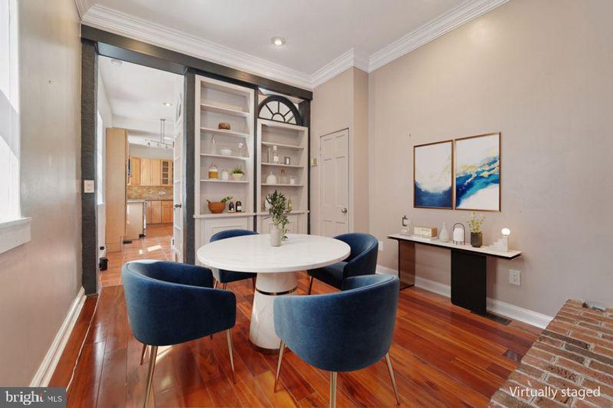 Welcome to 26 S Collington Ave, a charming end-unit townhome located in the heart of Baltimore. This beautifully maintained home showcases a perfect blend of historic character and modern updates.
The main level features gleaming wood floors, crown molding, and built-ins that add warmth and charm. A dual-sided fireplace creates an inviting ambiance, connecting the living and dining rooms seamlessly. The gourmet kitchen boasts granite countertops, stainless steel appliances, and ample cabinetry, making it ideal for everyday living and entertaining. A convenient half bathroom completes this level.
Upstairs, the spacious primary suite offers a private retreat with a fireplace, ensuite bath with dual vanities, and a walk-in closet. The second bedroom is equally impressive, with access to a walkout deck, and is served by a full hall bathroom.
The finished basement adds valuable living space, featuring a half bathroom, laundry area, and abundant storage options.
To top it off, this home includes a private rear parking pad, a highly sought-after feature in the city.
With its end-unit location, stylish finishes, desirable outdoor space, and off-street parking, this home is ready to welcome its next owner.