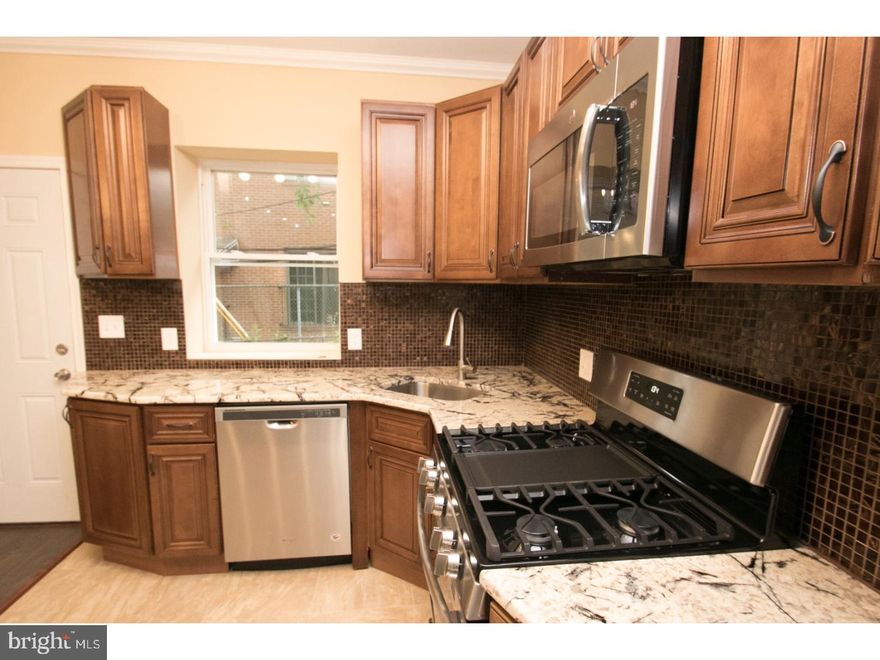 Unlike any other home on the market, this Cobbs Creek property is truly a something to see! Located on a beautiful quiet block with every extra you can imagine! The home has undergone a complete renovation inside and out! All new windows have been added and all new mechanicals have been installed to include (HVAC, Electric, Plumbing). The first floor features an open floor plan with a large living and dining area. There is also a powder room on the first floor for convenience. A new kitchen has been added to include all new appliances and tile throughout! In the kitchen you will find gorgeous wood cabinets. There is a also a newly constructed large deck, excellent for entertaining! Upstairs there are 3 bedrooms and a spa bath! There is also an additional half bath, central air and many more upgrades throughout!
