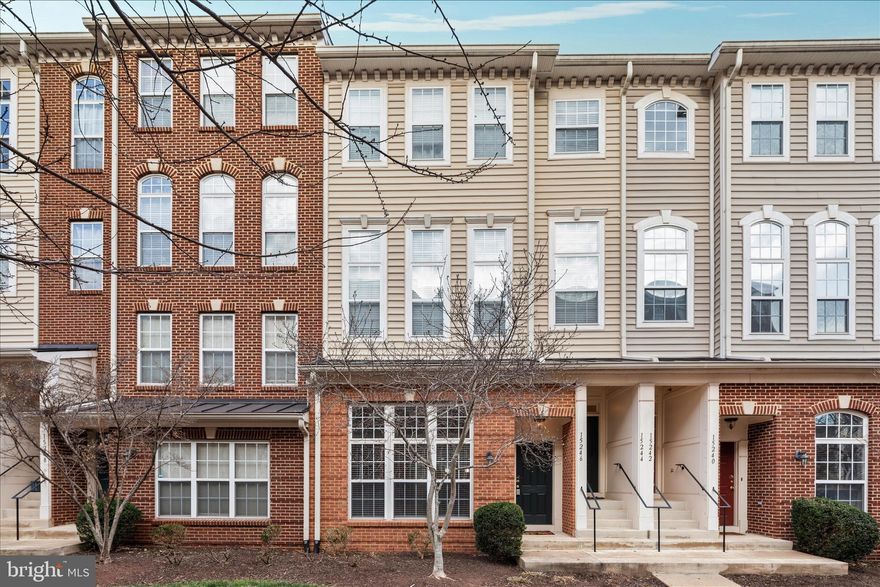 This well-maintained condo is located in Market Center, near the hospital in Haymarket. One of the best features of this specific unit is its location within the community — the pool,  picnic area, and tot lot are just around the corner.

The main level features hardwood floors throughout and an upgraded kitchen with granite countertops, gas cooking, and a new refrigerator (2025). The family room is open and bright with a two-story ceiling that gives the space a great sense of height and natural light. A convenient half bath is also located on the main level, along with access to the garage.

Upstairs, hardwood floors continue into two spacious bedrooms. The primary bedroom has its own private bathroom and includes a balcony, while the second bedroom is served by a full hall bathroom. The laundry is also conveniently located on the upper level.

Major systems have been updated, including a new water heater in 2025, a new refrigerator, and HVAC was recently serviced and operating like new.

The location is hard to beat — just minutes from the highly anticipated Sprouts opening in Haymarket, along with ample shopping, restaurants, Old Town Haymarket, and easy access to I-66.