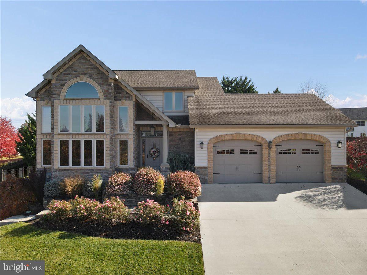 Welcome Home to 736 Cresson Drive, located in Laurich Ridge in Chambersburg, PA. This custom home is simply STUNNING. Floorplan features 15' front windows (UV screening) to take in the mountain views and flood natural sunlight into the open foyer, living and dining spaces. The staircase is a showstopper with the rod iron banister, showcasing the chandelier and veranda from the Primary bedroom. From the front living room, there's a dining area with tray & lighted ceiling which leads to the Kitchen. Cozy & sophisticated, the kitchen features glazed cabinetry, granite countertops, stainless appliances & counter seating. Open to the Family room, the space offers a stonewall & fireplace feature with built-ins, plantation shutters and attractive media set up. Just outside is a paver patio, fully fenced yard with privacy, shed & small garden with easy access to garage.
Upper level features a lovely Primary suite with trayed & lighted ceiling, balcony overlooking the massive front windows & living space, walk in closet and en suite, dual vanities & vessel sinks. Two additional bedrooms share a hall full bath with linen closet.
Lower level is a real opportunity! Second Kitchen, bedroom, full bath & living spaces with a walkout to small paver patio and path are perfect for in-laws or guest suite, adult children living at home or maybe even a rental to generate income and help pay your mortgage.
Other property features: Geothermal heat, underground sprinkler system, garage built-ins & storage, laundry / mudroom on main floor, located off garage.
Lovely neighborhood, just minutes from Downtown, shopping, eateries, schools and more. This custom home is a MUST SEE!
