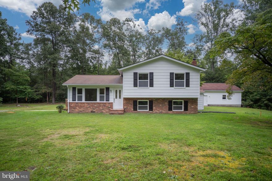 Welcome to this beautifully updated home just minutes from the charming town of Bowling Green. Set on a full acre, this property offers 3 levels of living space and is ideal for multigenerational living with its own private basement entrance.

The heart of the home features a fully renovated kitchen with sleek quartz countertops, freshly painted cabinets, and stainless steel appliances. New LVP flooring and plush carpet flow throughout, creating a fresh and modern feel.

With 4 spacious bedrooms and 3 full bathrooms—including a private primary suite—there’s room for everyone. Enjoy multiple living areas perfect for both entertaining and relaxing. Each bathroom has been thoughtfully updated with stylish new vanities and quartz countertops.

An oversized 2-car garage offers plenty of room not only for vehicles, but also for storage, hobbies, or a workshop space.

Major updates include new siding, new HVAC system, new windows, and a brand-new sliding glass door leading out to the back deck. Step outside to the gazebo and take in the peaceful setting.

This home is truly move-in ready and waiting for its new owners to make it their own. Conveniently located between Fredericksburg and Richmond, you’ll enjoy easy access to I-95, shopping, dining, and nearby military bases. Back on the market at no fault to the seller. Priced UNDER appraised value.