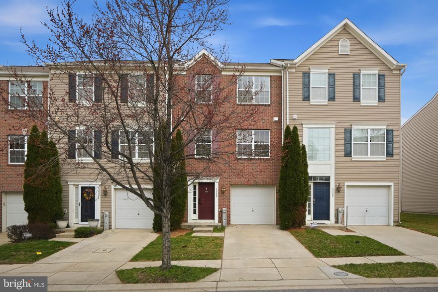 Welcome to this beautiful brick-front townhome with an attached garage, featuring fresh paint and brand-new carpet throughout much of the home. As you enter, you’re greeted by a welcoming lower-level living space with a combination of vinyl and carpet flooring and additional storage options, perfect for flexible living or recreation space. The main level offers an open and spacious layout with a bright kitchen, living room, and dining area. The kitchen features granite countertops, stainless steel appliances, abundant cabinet storage, and generous prep space, along with an island perfect for quick meals or gathering with friends. There is also plenty of room for a dining table. A convenient powder room completes this level. Upstairs, you’ll find three comfortable bedrooms.  The spacious primary suite includes a walk-in closet and a private bathroom with dual vanities and a walk-in shower. Two additional bedrooms share a full bathroom with a tub/shower combination. Step outside to the composite deck, perfect for summer BBQs and entertaining, overlooking the fenced yard. The attached garage provides convenient parking and additional storage. Major systems include the original roof and HVAC. Conveniently located near Liberty Road, Marriottsville Road, and Owings Mills Boulevard with easy access to shopping, restaurants, and everyday conveniences.