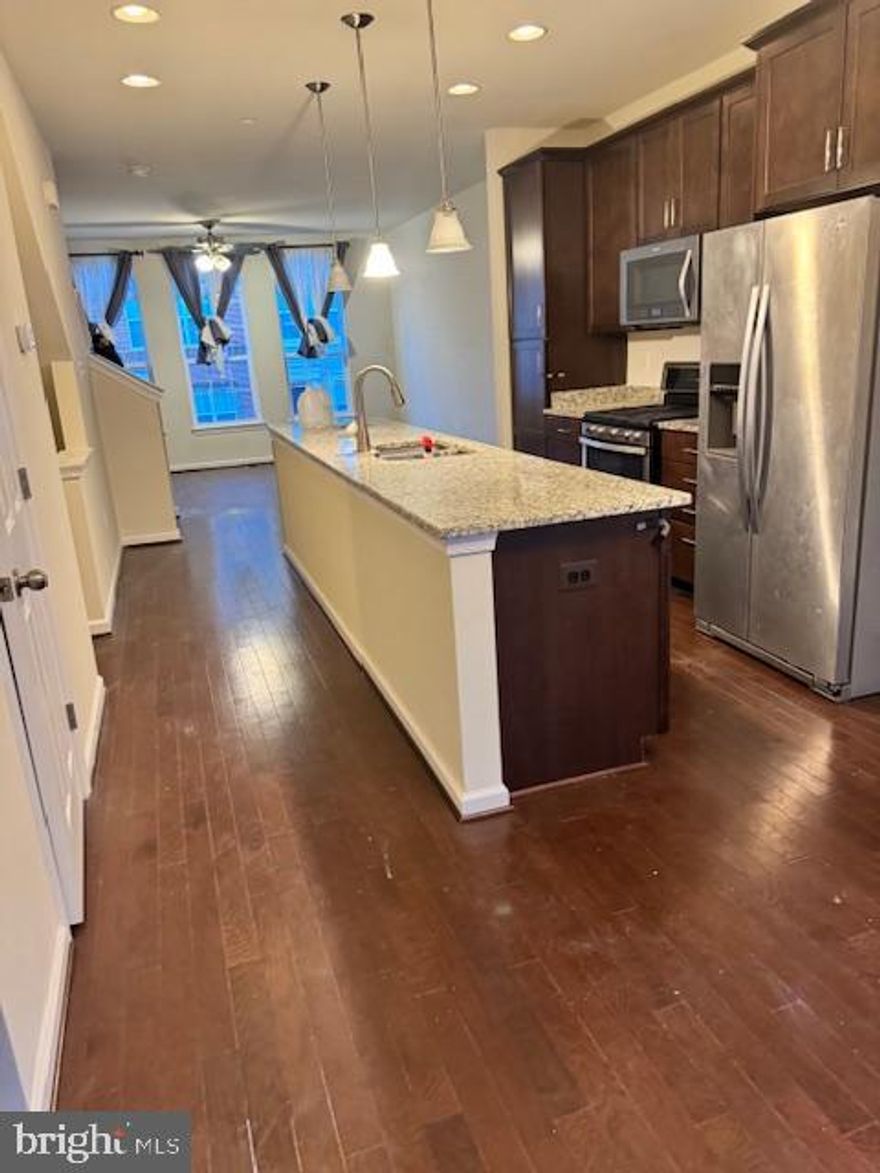 Discover your family's next home in this luxurious 3-bedroom, 2.5-bathroom townhouse located in the heart of one of Beltsville, MD's most sought-after neighborhoods. Spanning over 2,200 square feet across three levels, this property boasts an open concept living space with hardwood floors, large windows, a gourmet kitchen, and a private backyard. Ideal for long-term tenants, this home is just minutes from top-rated schools, shopping, dining, and offers easy access to I-95 for commuting. Features include an attached garage, modern appliances, and a master suite with an en-suite bathroom. Available for $3,000 per month, we're seeking families with excellent credit and stable income for a long-term lease in this safe, vibrant community.