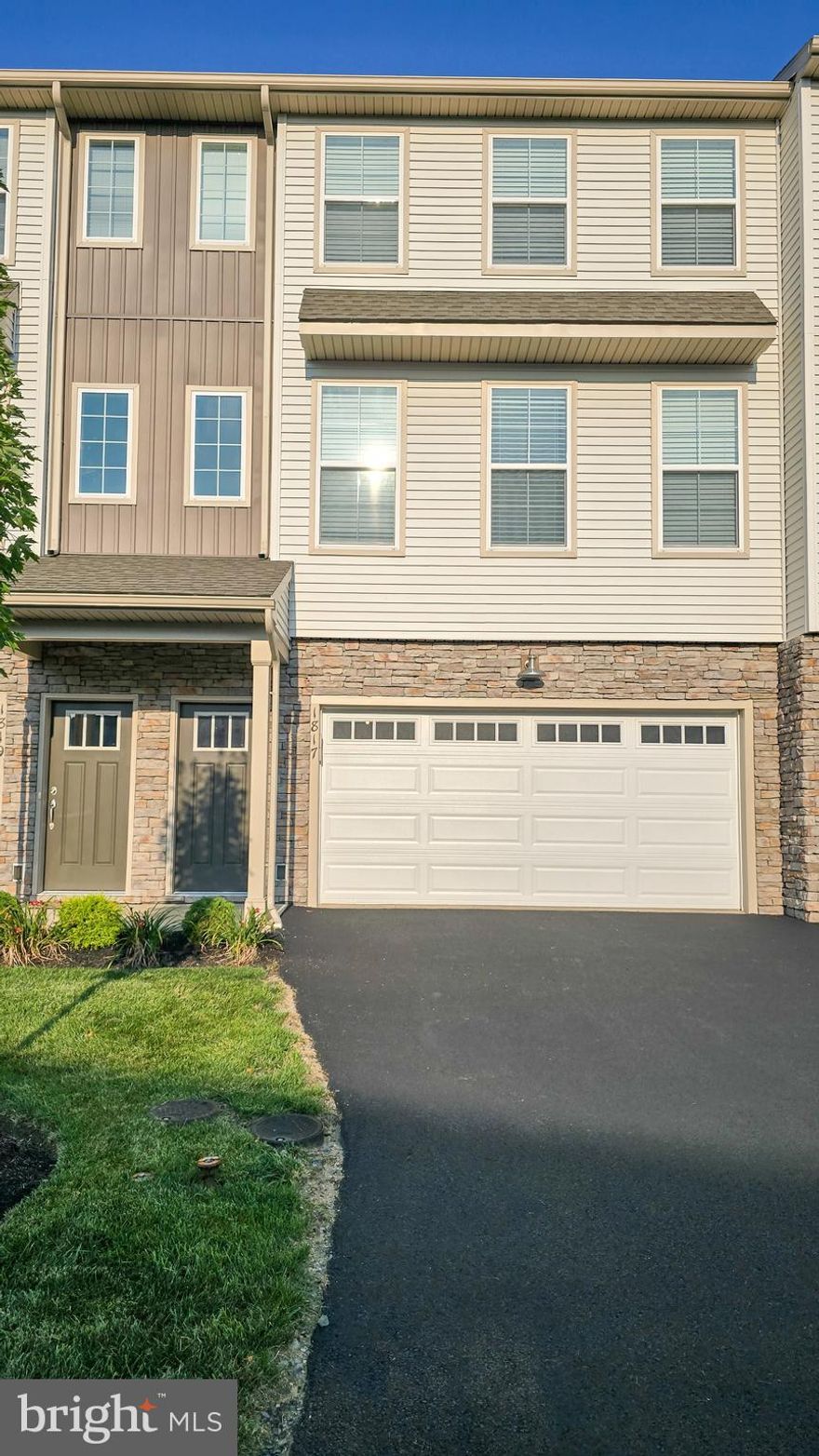 This 3-story townhome includes a 2-car garage with bonus room in the lower level and stylish vinyl plank flooring throughout the main floor. The spacious living room opens to the dining area and kitchen. The kitchen, featuring attractive cabinetry with crown molding, granite countertops with tile backsplash, and stainless steel appliances, has sliding glass doors that provide access to the backyard deck. The 2nd floor boasts all 3 bedrooms, 2 full bathrooms and laundry. The owner’s suite includes a private bathroom with 5’ shower and double bowl vanity, and an expansive closet.