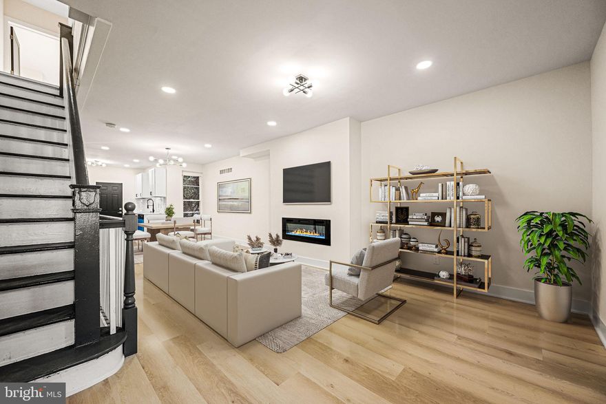 Welcome to 5215 N Marvine Street — a fully renovated 3-bed, 2-bath home on a quiet block in the heart of Logan. Step onto the welcoming front porch and into a bright, open living room with a modern electric fireplace. The dining area flows into a brand-new kitchen featuring stainless steel appliances, quartz countertops, and plenty of cabinet space. A rear door opens to a private backyard—perfect for morning coffee, outdoor dining, or a safe play space. Upstairs offers a sun-filled primary bedroom, two additional well-sized bedrooms, and a beautifully updated full bathroom. The fully finished basement runs the length of the home and provides flexible space for a media room, gym, office, or guest area, complete with a second full bathroom. With a front yard ideal for gardening or relaxing, this home delivers the comfort of suburban living with the convenience of the city. Move right in and enjoy this Logan gem.