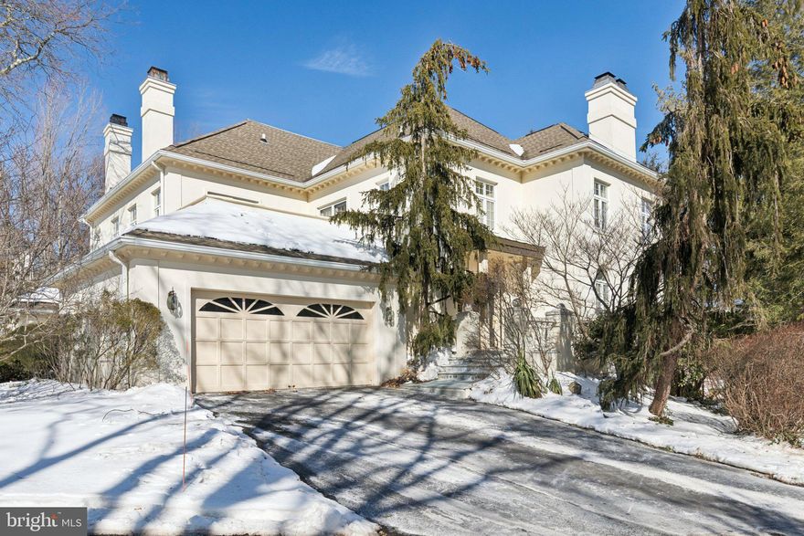 Welcome home to this well-maintained original model home with a walk-out lower level in the gated community of Wrenfield. You enter into a large two-story foyer with marble floors and will notice the wonderful natural light throughout. The living room features a fireplace, recessed lighting, palladium windows plus two sets of French doors that open to a large deck for your outdoor enjoyment. The living room opens to the formal dining room with hardwood floors, recessed lighting, and an outside entrance to the deck. The large kitchen includes a separate eating area, wood cabinets, an electric cooktop, a built-in Sub-Zero refrigerator plus a spacious walk-in pantry. The kitchen is open to a family room with a fireplace, recessed lighting and hardwood floors. A powder room and laundry room complete this level.The second floor boasts a spacious primary bedroom with high ceilings, numerous windows, recessed lighting, a custom walk-in closet and a luxurious full bath that includes a whirlpool tub, a walk-in shower, and two separate areas with sinks plus a makeup area. There are also two additional large bedrooms with a Jack and Jill tiled bathroom. A second-floor deck extends off the hallway. The walk-out lower level features a large family room/office with built-ins, a wet bar, and a fireplace. It also includes a fourth bedroom, a full bathroom, a mirrored exercise room, and a walk-in cedar closet. This home has numerous upgrades throughout, including an elevator, recessed lighting, nine-foot ceilings, custom closets plus much more. There is an oversized two-car attached garage with direct access to the first floor of the home. Bring your creativity to make this special home your own. You will not be disappointed.