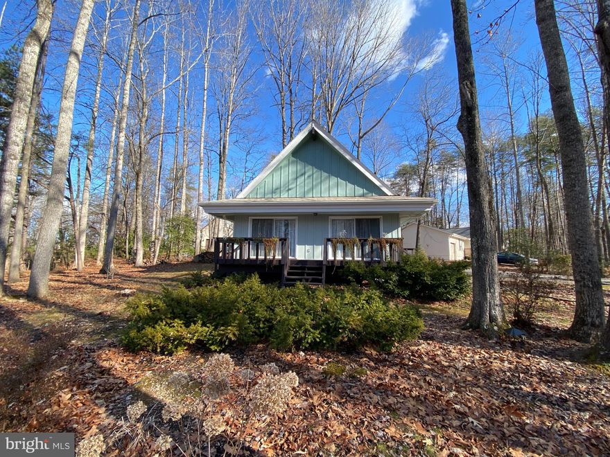 Charming Chalet-Style Cottage in Lake of the Woods! This character-filled home features beautiful hardwood floors and a cathedral ceiling. The main level offers an open floor plan that has a living room, a wood-burning stove, a kitchen/dining area, two bedrooms, and a full bath. One of the bedrooms currently houses the full-size washer and dryer but could be the perfect space for a home office or bonus room. Head upstairs to your third bedroom and full bath with a large tiled shower. This property offers beautiful landscaped woodland scenery year-round. 
The Lake of the Woods community is filled with amenities including 2 outdoor swimming pools, 2 lakes, playgrounds, walking trails, tennis courts, pickleball courts, basketball courts, a golf course, an equestrian center, a clubhouse, a fitness center and so much more. 

$25 Monthly Resident Benefits Package.
$125 Leasing Fee. One time due with Move in Funds.
Pets are considered on a case-by-case basis.
*Photos coming soon!*