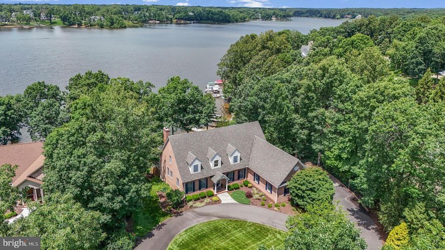 Luxury Lakefront Living at Its Finest! A spectacular waterfront retreat where stunning lake views, elegant design, and gated community living come together in the heart of the exclusive Fawn Lake community.
Located on the lake's original and most desirable section, this exceptional 5-bedroom, 5.5 bathroom home offers over 5,381 square feet of luxurious living space, 9-foot ceilings, and breathtaking panoramic water views.
From the moment you step inside, you’ll be captivated by the grand two-story foyer, elegant staircase, and soaring windows that frame the lake and flood the home with natural light. Built by Coleman Homes, this home showcases superior craftsmanship, featuring gleaming hardwood floors, custom woodwork, built-in bookcases, double-pane insulated windows, and thoughtful architectural details.
To the right of the entry, the formal dining room sets the tone for sophisticated entertaining. To the left is a handsome home office with custom bookcases offering a peaceful work-from-home space or private retreat. Straight ahead, the inviting family room with a cozy wood-burning fireplace opens seamlessly to the spacious kitchen, which features a comfortable sitting area and casual dining space—ideal for everyday living and entertaining.
Tucked privately on the main level, the Owner’s Suite offers serene lake views and a spa-inspired bathroom with a Jacuzzi tub, glass-enclosed shower, dual vanities, and a separate water closet. A conveniently located powder room is also available for guests.
Step from the family room onto a large screened-in porch, where you will find that the grill is connected to the home’s propane line, allowing for year-round outdoor cooking and dining.
Upstairs, you’ll find three generously sized bedrooms and two full bathrooms, perfect for family or guests.
The fully finished lower level is a dream for entertainers. Enjoy an expansive open space with a gas fireplace, custom mantel, and a wet bar with under-cabinet lighting—perfect for hosting game nights or casual gatherings. A fifth bedroom and full bathroom offer additional accommodations. The abundance of storage is amazing, with a backyard access, it makes it easy to store all your lake toys. The home also includes an in-ground sprinkler system, pulling from the lake, keeping the beautifully landscaped grounds lush and green.
And then there’s the outdoor space—an absolute showstopper. Professionally designed hardscaping leads to multiple seating areas right at the water’s edge. Whether you’re roasting s’mores by the chimenea or simply enjoying a quiet evening watching the sunset, this home offers the perfect backdrop for making memories. A few steps lead directly through the masonry bulkhead to the lake, offering effortless access for your kayak, paddleboard, or a relaxing dip in the water.

This home is not just about where you live—it’s about how you live.

The Fawn Lake Lifestyle
Beyond your private waterfront retreat, Fawn Lake offers an extraordinary lifestyle. Enjoy the Arnold Palmer Signature Golf Course, Har-Tru clay tennis courts, basketball, volleyball, and pickleball courts, miles of scenic walking trails, a dog park, and a state-of-the-art fitness center. The vibrant community clubhouse and beautiful lakeside pool are perfect for connecting with neighbors and enjoying the best of resort-style living.
As an added bonus, a golf membership can convey at a discounted rate, offering even more value to this exceptional offering.
This is more than a home—it’s a lifestyle.
Your lakefront dream begins at 11203 Field Circle.