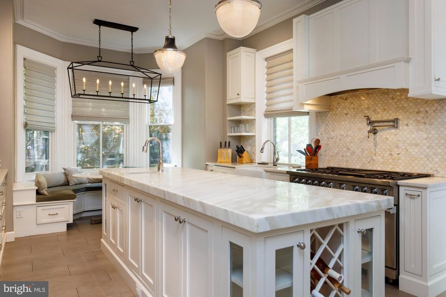 **Seller will pre pay one year parking at a local garage.*** Tucked on one of Fitler Square’s most coveted blocks, 2222 Delancey Place is a four-story historic home reimagined with modern functionality and timeless style. With 4+ bedrooms, 4.5 baths, and multiple living spaces, there’s room to spread out—and come together.

The main floor is warm and welcoming, with original pine floors, high ceilings, and a wood-burning fireplace. The kitchen is a standout: Calcutta marble island, Viking range, Sub-Zero fridge, Bosch dishwasher, and custom cabinetry from wall to wall. A built-in banquette overlooks the private garden, perfect for casual meals or morning coffee. There’s also a stylish powder room and coat closet on this level.

Upstairs, the entire front of the second floor is the Primary Suite, complete with a dressing room outfitted by California Closets and a spa-like bath featuring a clawfoot tub, glass shower, and double vanity. A den with fireplace and built-ins sits in the rear, ideal for work or winding down.

Three more bedrooms and two full baths are on the third floor. The finished lower level includes a garden-facing family room with wet bar, bonus room for gym, office, or guests, a full bath, laundry room with built-ins, and a wine closet.

Outside, the garden terrace is quiet, green, and ready for entertaining.

10 year tax abatement good through 2026.