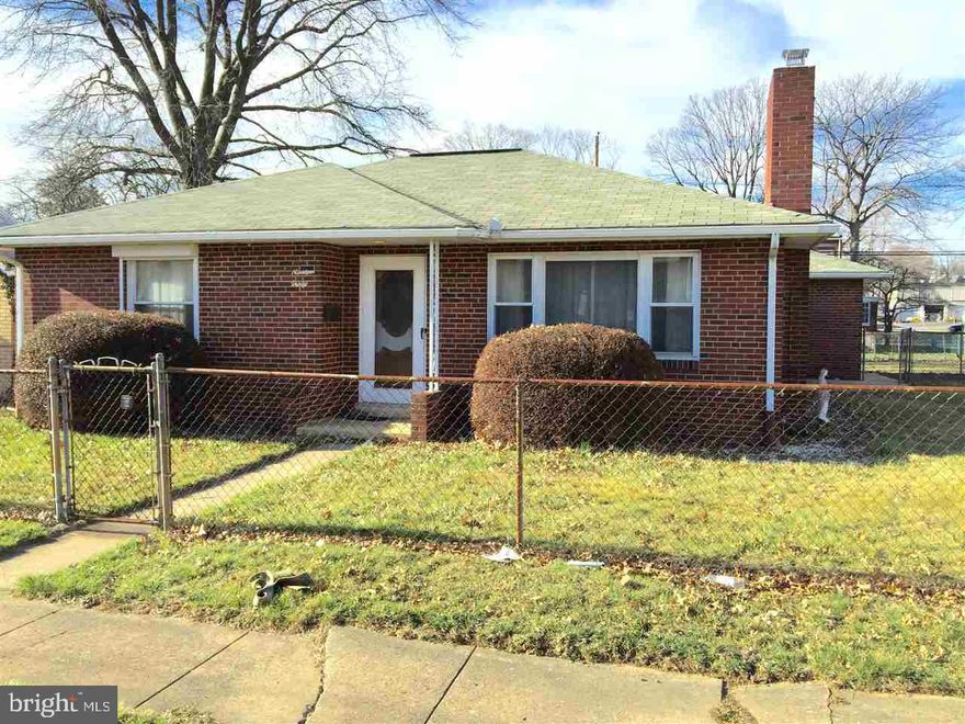 PRICED TO SELL! Inviting 2 bedroom 1 1/2 bath all brick ranch home w/ large fenced yard on corner lot. Spacious living room w/ brick fireplace, kitchen has lots of cabinets, pantry, eating area, refrigerator, new gas range & new range.  Hardwood flooring throughout, central air, newer roof & replacement windows.  Full bath has walk in therapeutic media tub w/ jets, new floor, new cabinet & new lighting. 1 car garage is entered through breezeway. Covered patio, lots of storage, 1/2 bath in the dry basement.