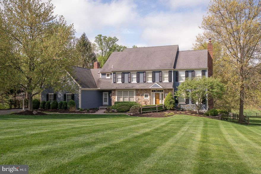 Welcome to 30 Spring Hill Lane in the highly desirable Sunwood Farm neighborhood. This impressive stone-and-siding colonial offers over 4,100 square feet of beautifully maintained living space on a private 1.7-acre cul-de-sac lot. The home features five bedrooms, three full and two half bathrooms, a three-car side-entry garage, and exceptional outdoor living with a large deck, awning, and a saltwater in-ground pool with attached hot tub.  A paver walkway, surrounded by manicured landscaping, leads to the mudroom entry and covered front entrance. Inside, a dramatic two-story foyer showcases a turned oak staircase, along with a coat closet and powder room. The sun-filled office features a wall of windows and custom built-ins, while the formal living room offers a wood-burning fireplace with brick surround and custom mantel. The dining room is ideally located off the kitchen and enhanced by chair rail and crown molding.  The spacious kitchen includes maple cabinetry, granite countertops, tile flooring and backsplash, stainless steel appliances, a center island with seating, and a built-in workstation. The adjacent breakfast room features a triple panel door to the rear deck, while the family room impresses with vaulted ceilings, exposed beams, a Palladian window, and a floor-to-ceiling stone fireplace. A laundry room with garage access completes the main level.  Upstairs, the primary suite offers a vaulted ceiling, dressing area, custom walk-in closet, and a well-appointed bath with dual vanities, soaking tub, skylight, and walk-in shower. Four additional bedrooms, a full hall bath, and an en-suite bath complete this level.  The partially finished walk-out basement provides excellent additional living space, including a recreation room with fireplace, billiards area, bar, half bath, and generous storage.  Additional highlights include hardwood flooring throughout much of the main level, plantation shutters, two new HVAC systems (2024), and fresh neutral paint. Meticulously maintained by its original owners, this home combines timeless design with modern comfort.  Ideally located in the Phoenixville Area School District, just minutes from shopping, dining, King of Prussia, the Main Line, and the vibrant town of Phoenixville.