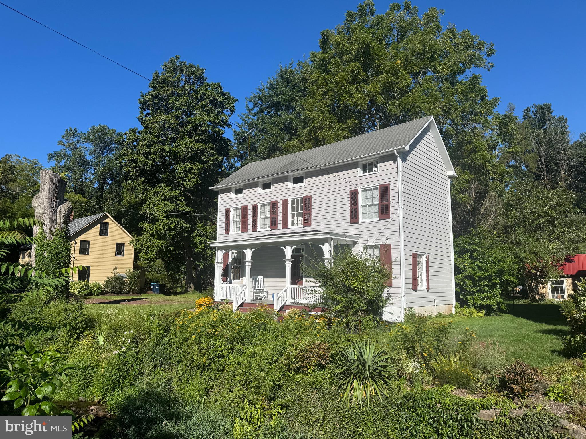 Historic farmhouse in Carversville, Bucks County, built around 1865. The property has been beautifully restored, combining historic charm with modern amenities. It is located just across a stone bridge over Paunacussing Creek and near the Carversville Inn & General Store. Key features include an inviting front porch with peaceful surroundings, original craftsmanship such as wide plank floors and classic plaster walls, chef’s kitchen with stainless steel appliances, leathered quartz countertops, a breakfast bar, and handmade terra-cotta floors with radiant heat, sliding glass doors in the eat-in area offering scenic views, three bedrooms and two and a half bathrooms, second-floor laundry with washer/dryer hookups. A great weekend escape. Proximity to Doylestown, New Hope, and only 90 minutes from New York City,