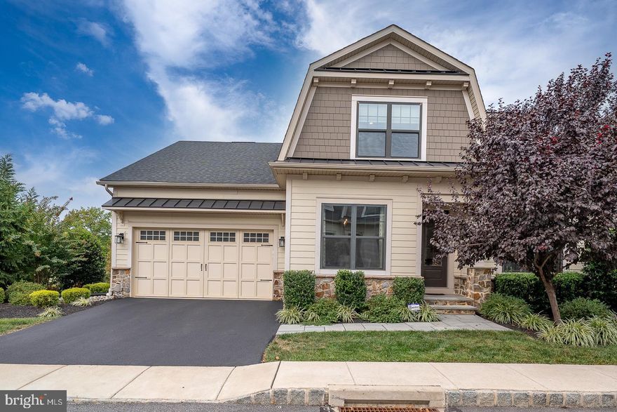 Welcome to 302 Ap Even Road in Wayne Glen – a fully loaded Bryn Mawr model home in the award-winning Tredyffrin-Easttown School District. Offering 4/5 bedrooms, 4 full bathrooms, and 4,514 square feet of beautifully finished living space across three levels, this home combines luxury, functionality, and modern convenience with every upgrade already in place. The expanded open-concept floor plan showcases a fabulous great room with vaulted ceilings and a gas fireplace, seamlessly flowing into the gourmet kitchen. Here you’ll find high-end stainless steel appliances, gleaming quartz countertops, a massive center island, abundant cushion-close cabinetry, farmhouse sink, tiled backsplash, and a sitting room addition. From here, step out onto the maintenance-free Trex deck—perfect for outdoor relaxing, entertaining, and dining al fresco. An elegant formal dining room provides the ideal setting for both intimate dinners and large gatherings. French doors off the kitchen open to a home office or study.  The first-floor primary suite is a true retreat with a tray ceiling, professionally designed walk-in closet, and a spa-like ensuite bath featuring a huge Roman shower, double granite vanity, and private water closet. A first-floor guest suite with private bath, and spacious laundry/mudroom with built-ins and access to the 2-car garage with EV charging outlet complete this level. Upstairs, an airy loft overlooks the great room, along with one bedroom, full bath and a bonus room. The finished walkout lower level offers full windows, sliding glass doors to a bluestone patio, and endless versatility. This expansive space is perfect for a family room, media room, gym, or playroom. A private bedroom with adjoining full bath makes this an ideal guest, in-law, or au pair suite. An additional finished room plus large storage area add even more flexibility. Additional highlights include: state-of-the-art systems, irrigation system, exterior flood lighting, and countless custom upgrades throughout. All of this in a prime Wayne location close to shopping, dining, parks, and major routes—making 302 Ap Even Road a truly exceptional place to call home.