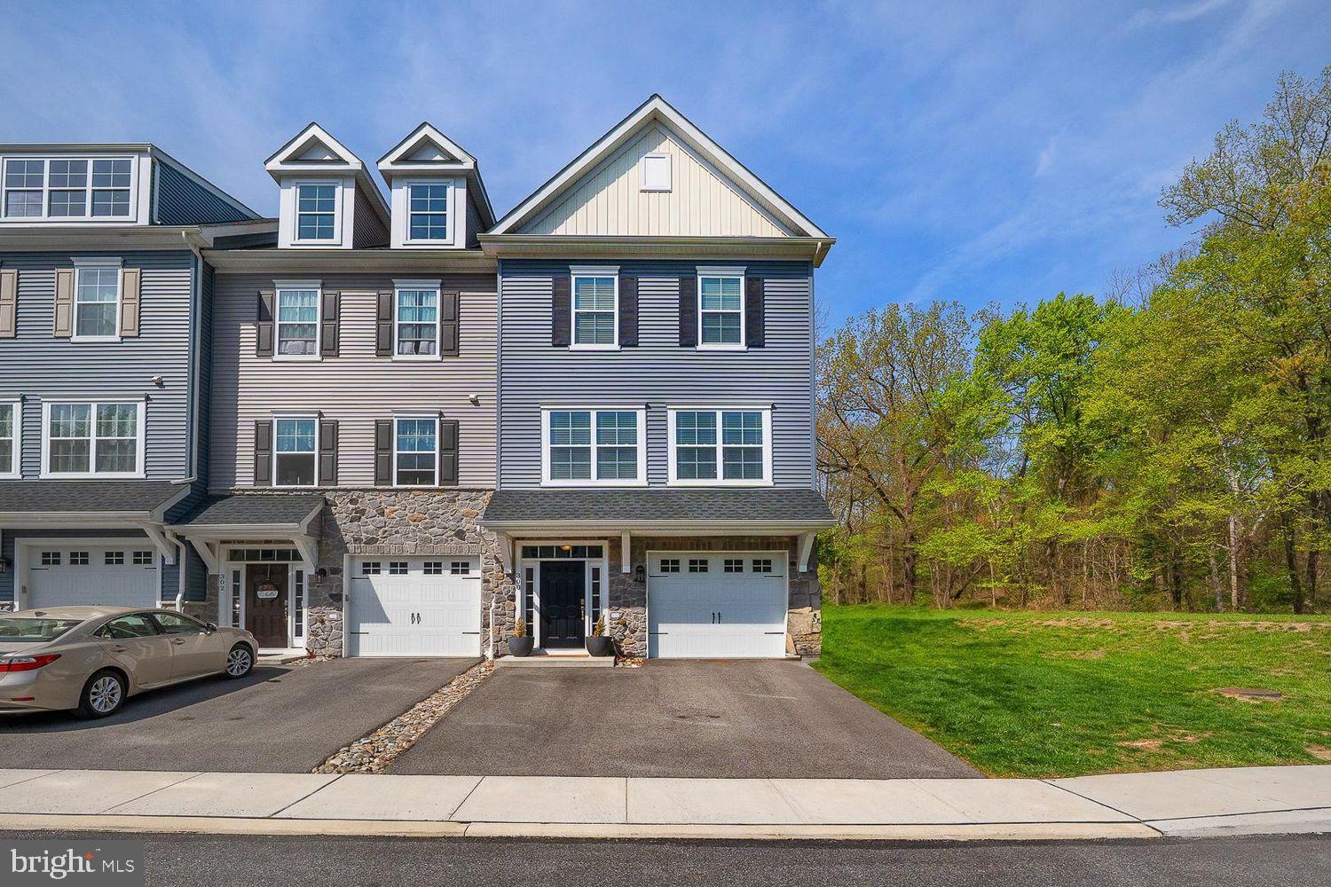 Don't Miss This Opportunity - One of the only new construction townhome communities in Broomall is ready to welcome you home. Nestled in a serene wooded enclave yet moments from everything you need, this sophisticated residence offers a perfect blend of modern design, high-end finishes, and energy-efficient technology. Built in 2021 by Rockwell Custom, this thoughtfully designed end of row townhome spans four levels and over 2,600 sq. ft. of beautifully crafted living space, including a first-floor flex space, a fourth-floor loft, and an attached garage. Located within the desirable Marple Newtown School District. The main level features an open-concept layout, offering a seamless flow between the living, dining, and kitchen areas. Expansive windows bathe the space in natural light, while 9-foot ceilings create an airy, welcoming atmosphere. The living room is anchored by a cozy fireplace, custom built-in shelving, and recessed lighting, with a spacious deck just beyond, perfect for summer entertaining. The gourmet kitchen showcases floor-to-ceiling cabinetry, granite countertops, stainless steel appliances, gas cooking, and soft-close doors and drawers. Upstairs on the third floor, the luxurious primary suite serves as a serene retreat, complete with a spa-like bathroom featuring a frameless glass shower and double vanity. Two additional bedrooms, a shared hall bath, and a convenient laundry room complete this level. The top floor offers a fourth bedroom and a versatile loft space, ideal for a playroom, den, or home office. The first floor features a generous flex space, perfect for a home gym, family room, or guest suite, with direct access to the attached garage. A private driveway provides an additional parking space. Move-in ready and meticulously maintained, this pristine townhome combines effortless living with a prime, highly sought-after location. Nearby amenities include the newly renovated Lawrence Park Shopping Center, featuring Crumbl Cookies, PJ Whelihan’s, Barnes & Noble, HomeGoods, and more. You'll also find LA Fitness, Lawrence Park Swim Club, Marple Sports Arena, and Veteran’s Memorial Park and Playground are just minutes away. Enjoy easy access to major roadways (I-76, I-476, Route 3, Route 252), offering seamless commutes to Philadelphia, King of Prussia, Delaware, Montgomery and Chester Counties, and Philadelphia International Airport (PHL). Experience the serenity of this idyllic neighborhood paired with a low-maintenance, luxury lifestyle and a wealth of nearby conveniences.