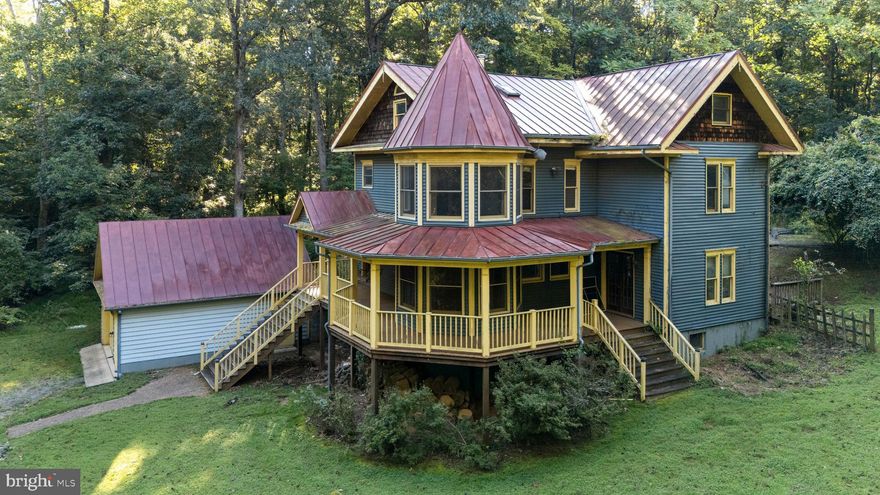 PRICE IMPROVEMENT! Victorian charm and then some! Welcome home to your custom-built  home on 12 acres of privacy! Come sit a spell on your front porch and enjoy your wooded paradise. Just bring your imagination and sweat equity to what this home could be.  This 3 bedroom, 2.5 bath home oozes charm and character - wide plank hardwood floors throughout your foyer, living and all bedrooms,  and a wood stove to warm up to on fall evenings.  Custom wood trim surrounds every window with individualized charm. The kitchen is the heart of the home, with loads of cabinet space and a spacious tile island, pantry and eat-in space.  Large dining  room with french doors leads out to your wraparound front porch. Three large bedrooms and 2 full baths upstairs, complete with  unique claw foot tub. But your fourth floor/attic space has unlimited potential! Windows and skylights make this attic space warm and cozy,  just perfect for a home office, library, or craft space.  Lower level walkout basement boasts loads of storage and even more potential. Enjoy the sights and sounds of nature in your own private wilderness,  including a trail throughout the property—perfect for hiking, biking, or peaceful forest walks.  Detached double garage, great for a workshop. Only minutes from downtown Round Hill, convenient to shopping, wineries and the beauty of Northern Virginia! This one is truly a diamond in the rough, you have to see it to appreciate it!